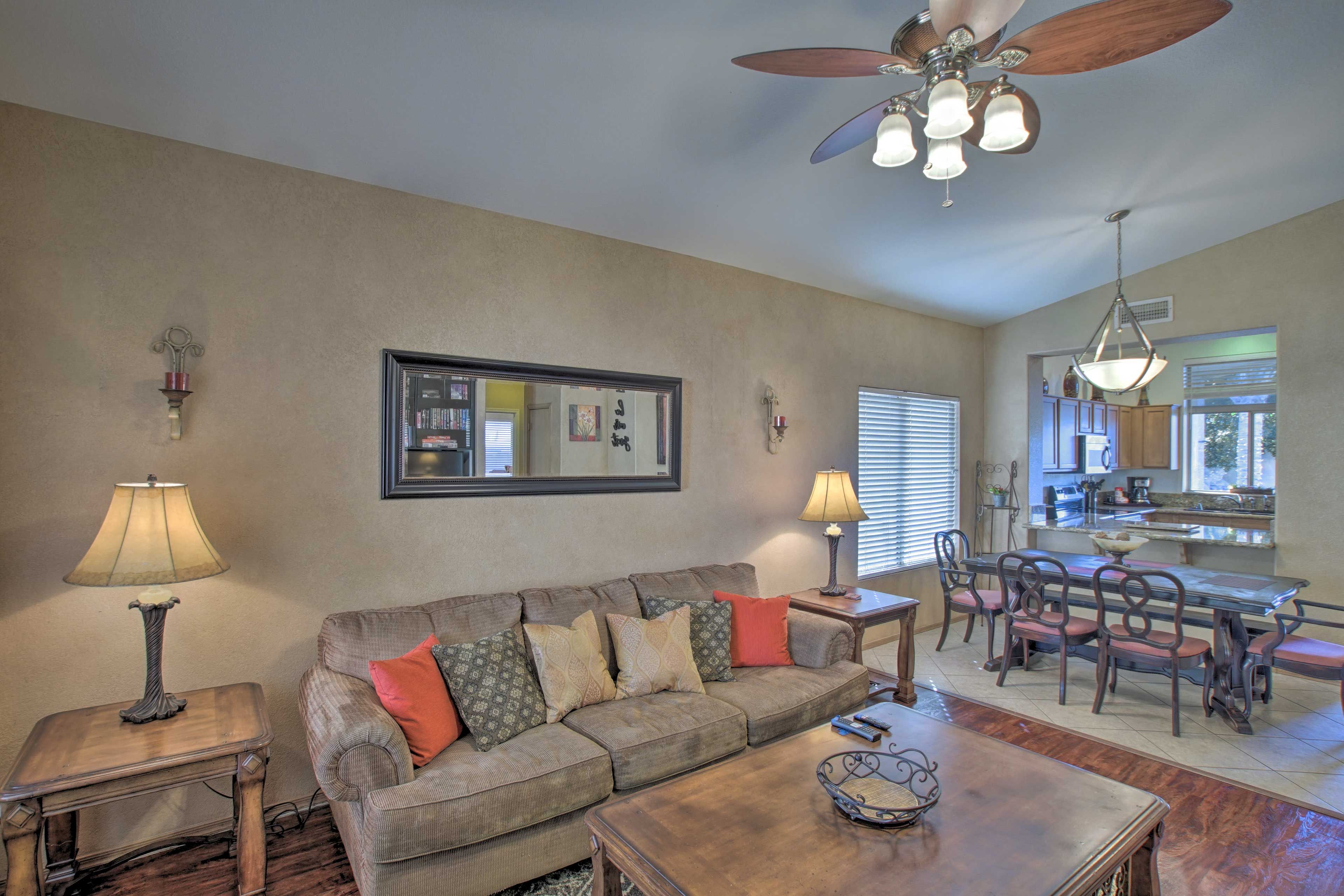 The living area hosts comfortable furnishings for lounging.