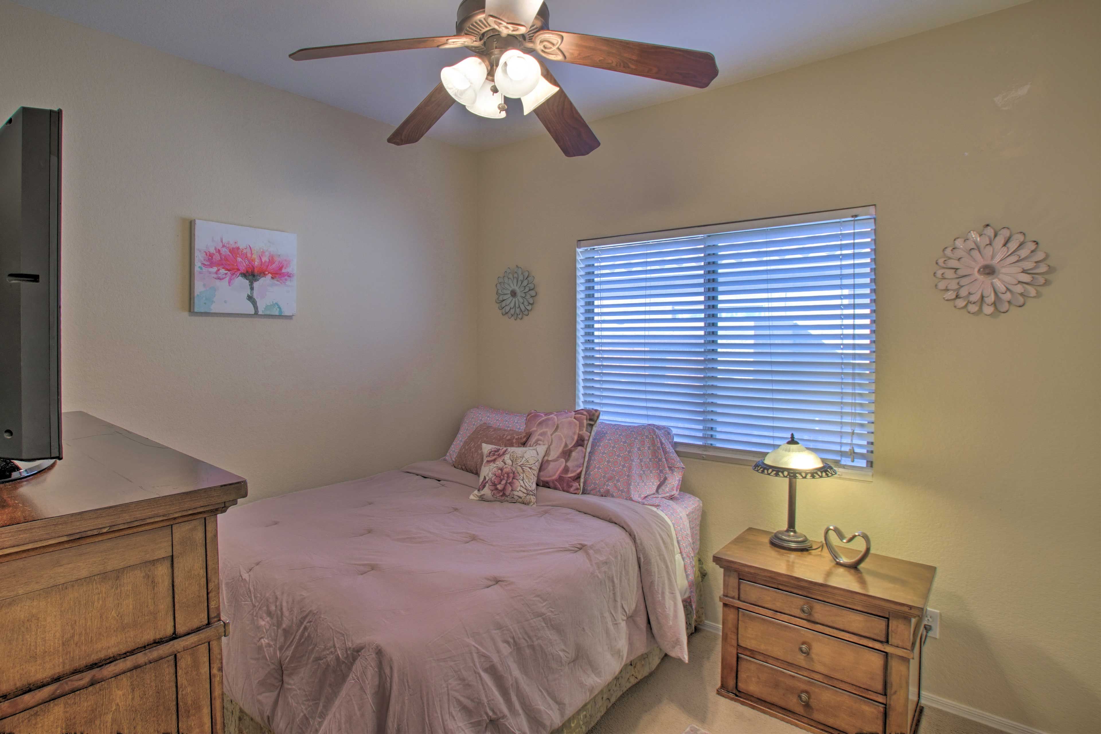 A third bedroom hosts a queen bed.