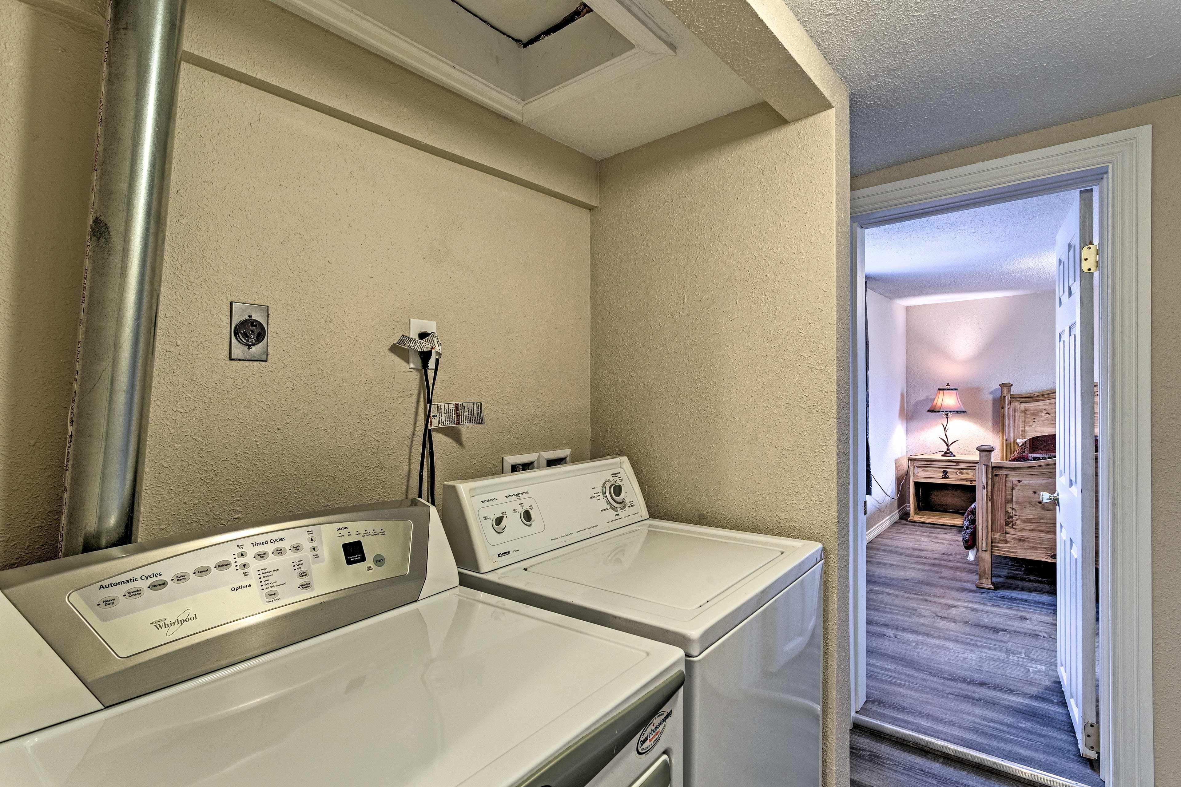 Across the hall is the washer and dryer and additional bedroom.