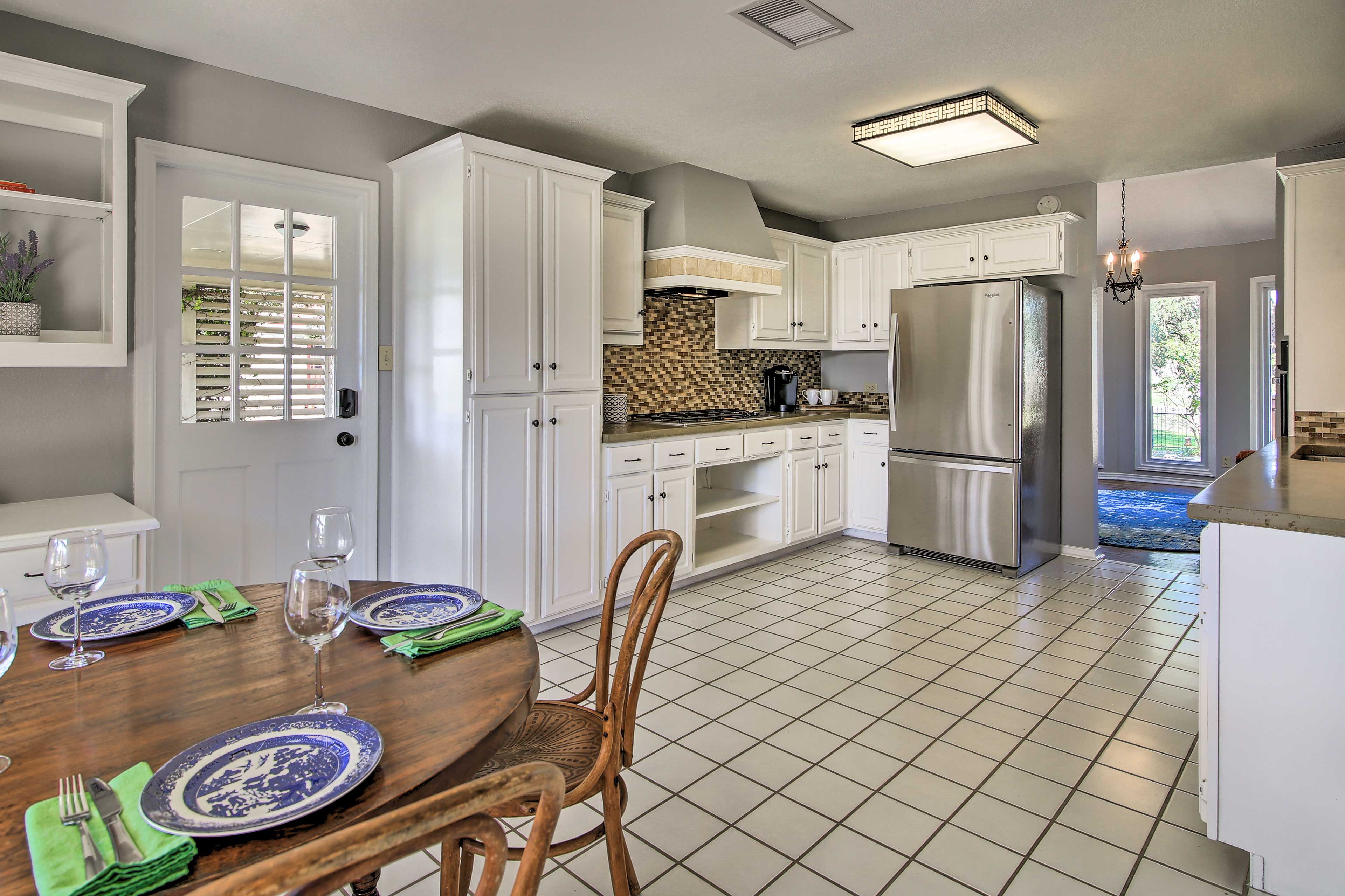 Stainless steel appliances really pop against the white cabinetry.
