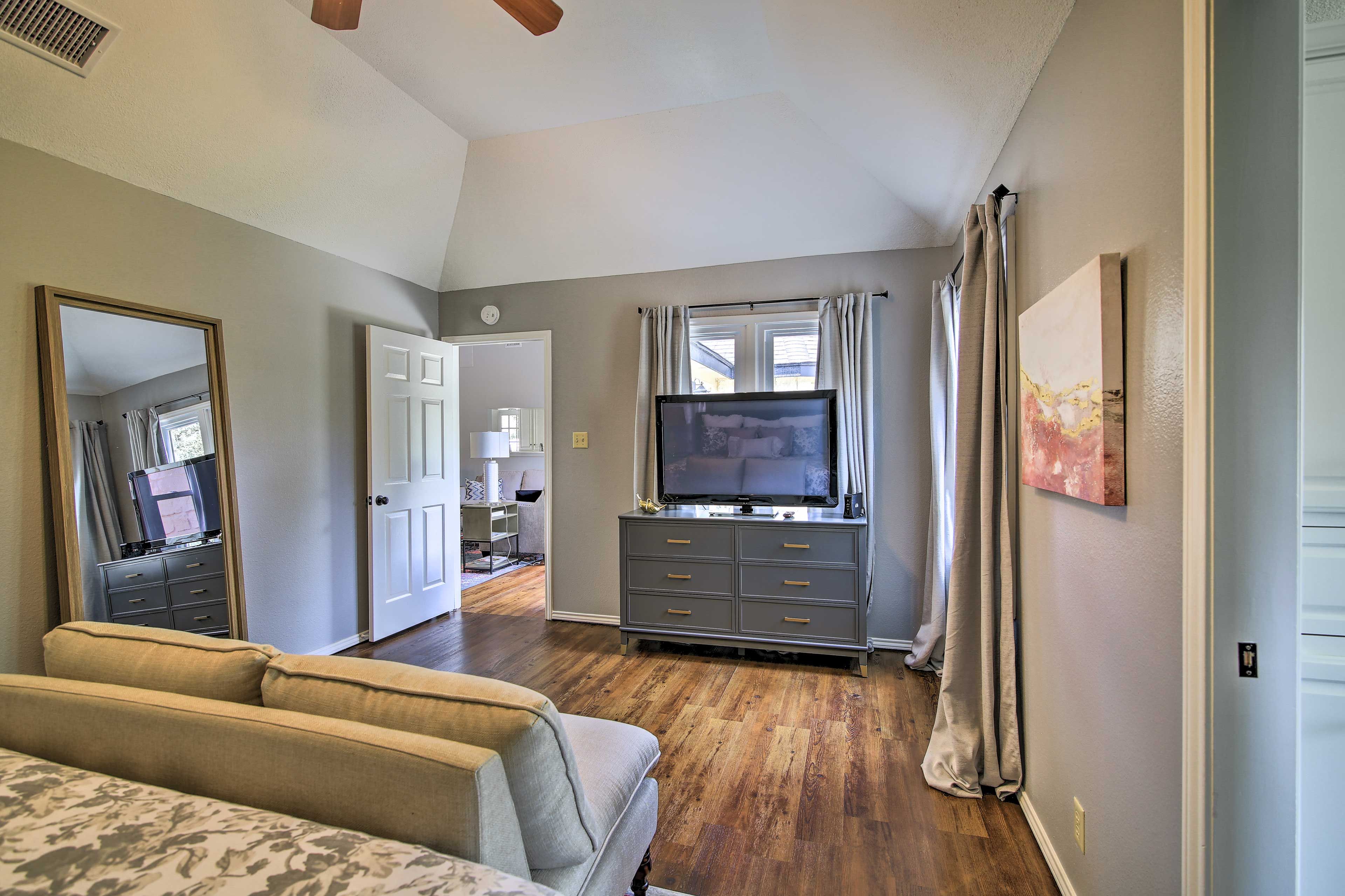 Sit down on the new sofa and watch the flat-screen TV.