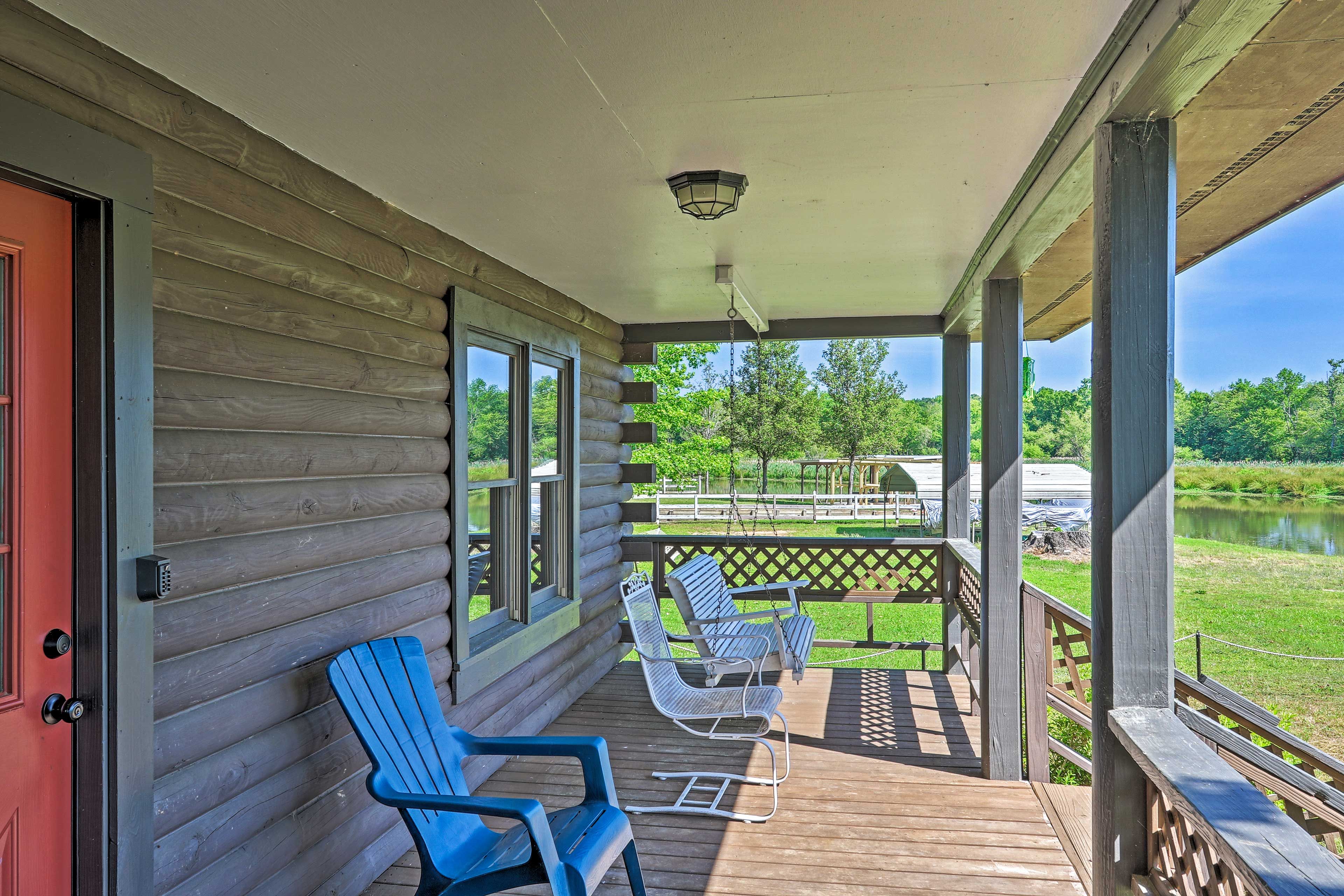 Outdoor amenities include a gas grill, dock, and furnished porch.