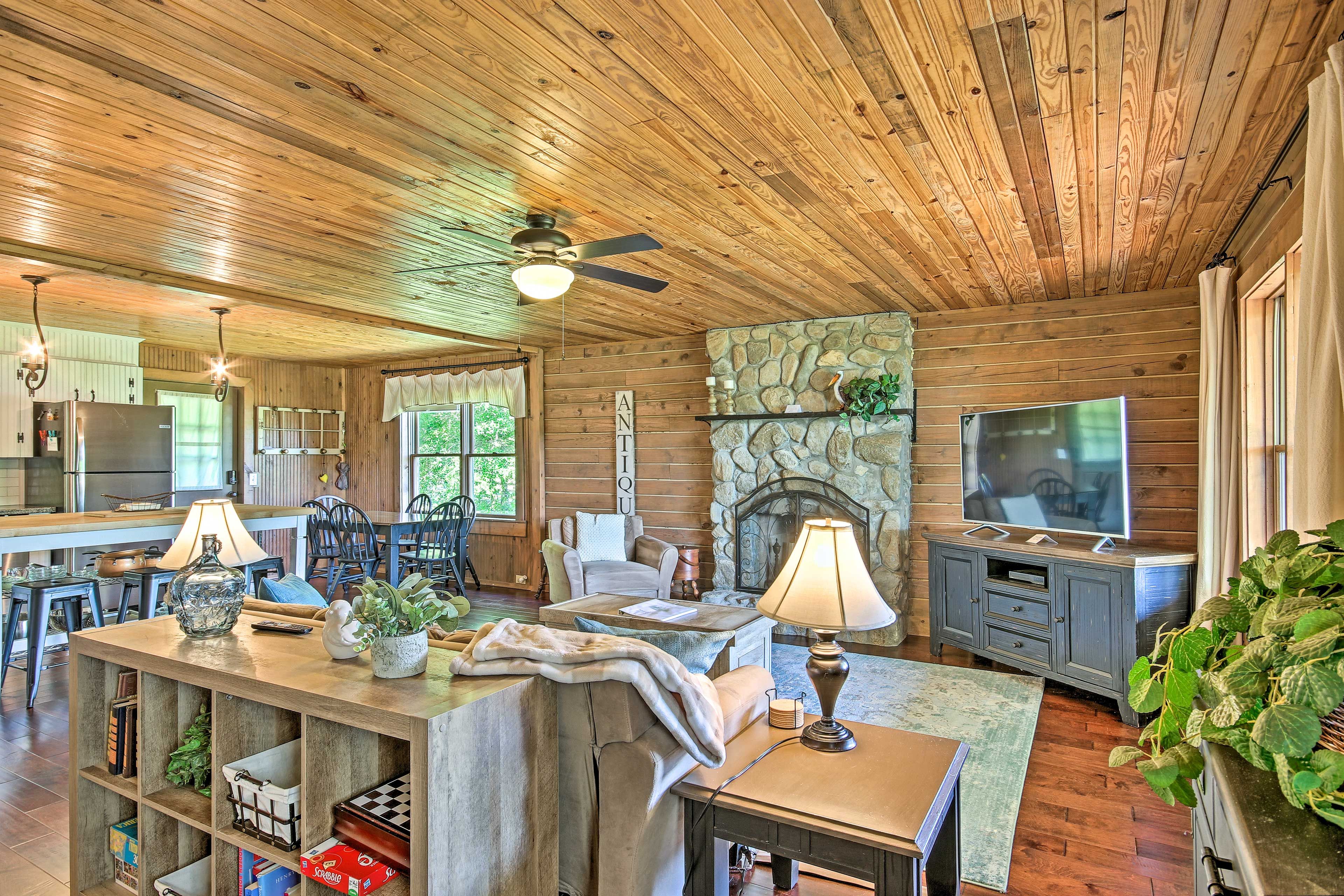 The living room features a Smart TV and fireplace.