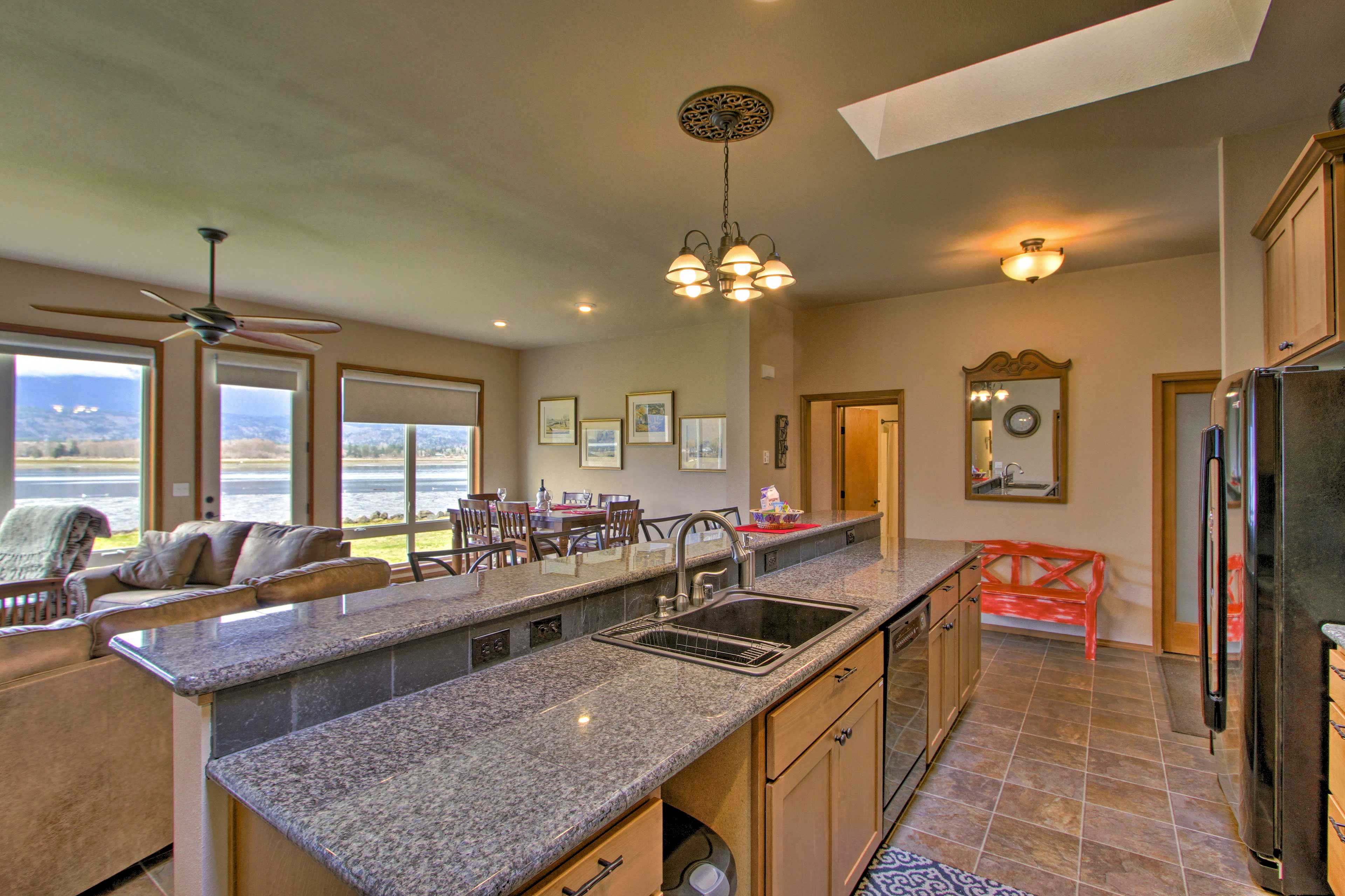 Sit at the breakfast bar and sip a cup of coffee from the drip coffee maker.