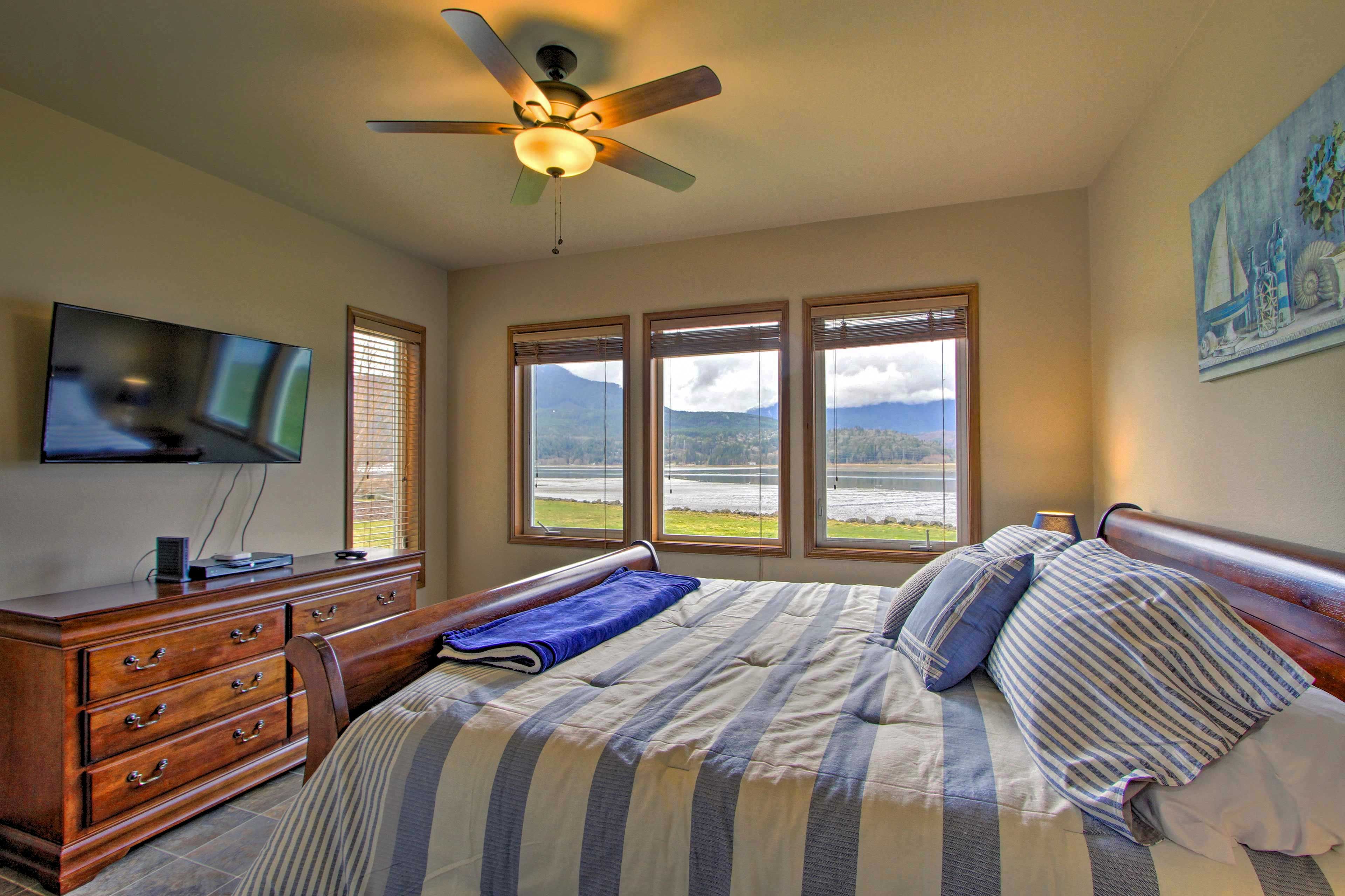 The master bedroom has showstopping mountain vistas and a king bed.