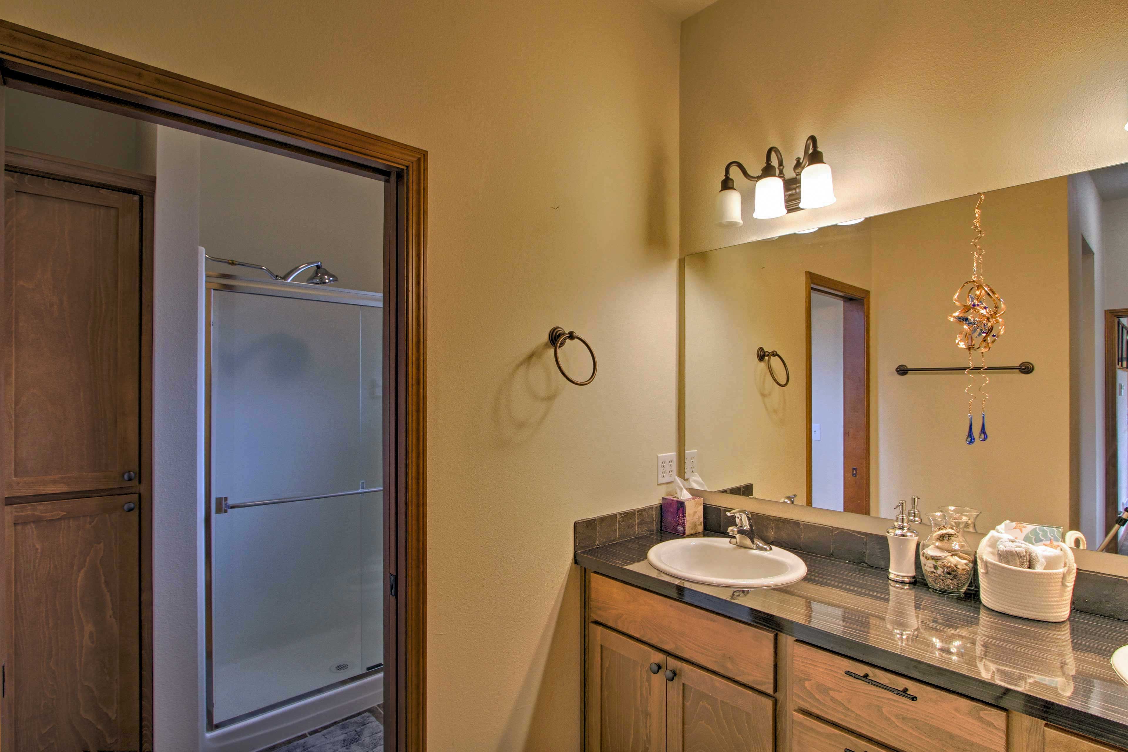 The master bathroom has dual sinks and a walk-in shower.