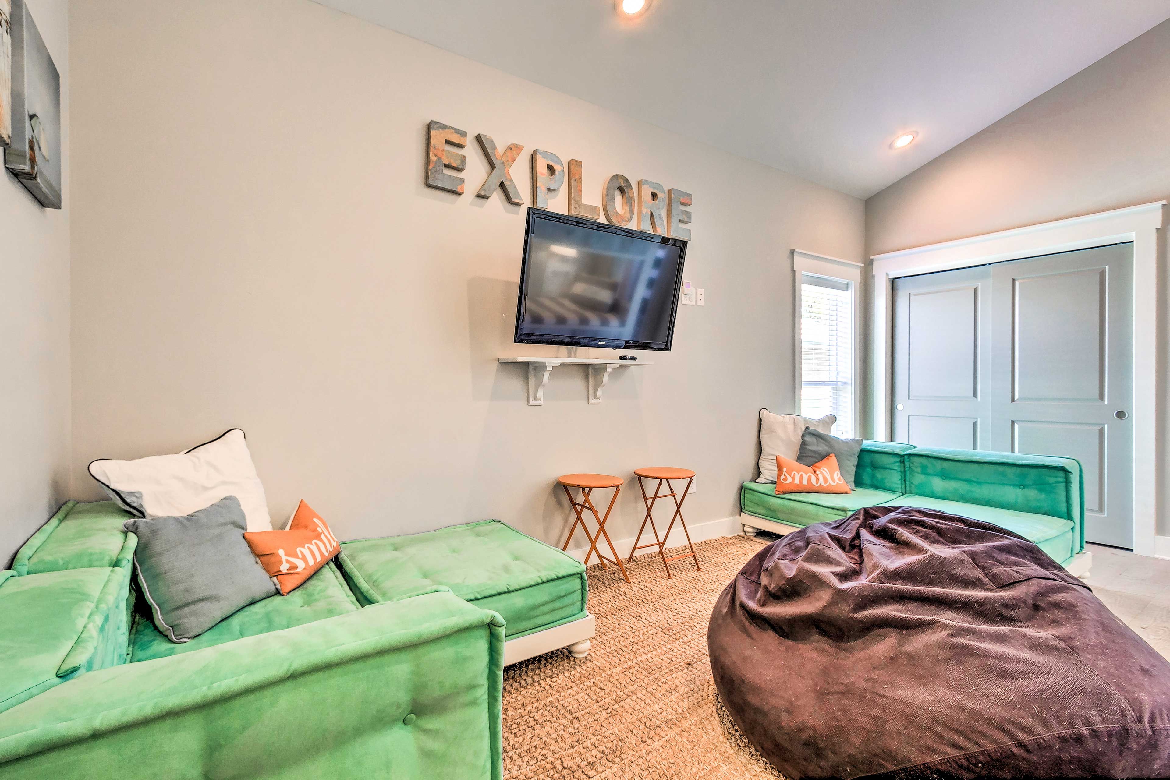 Explore this kid-friendly corner of the home, complete w/ a beanbag chair & TV!