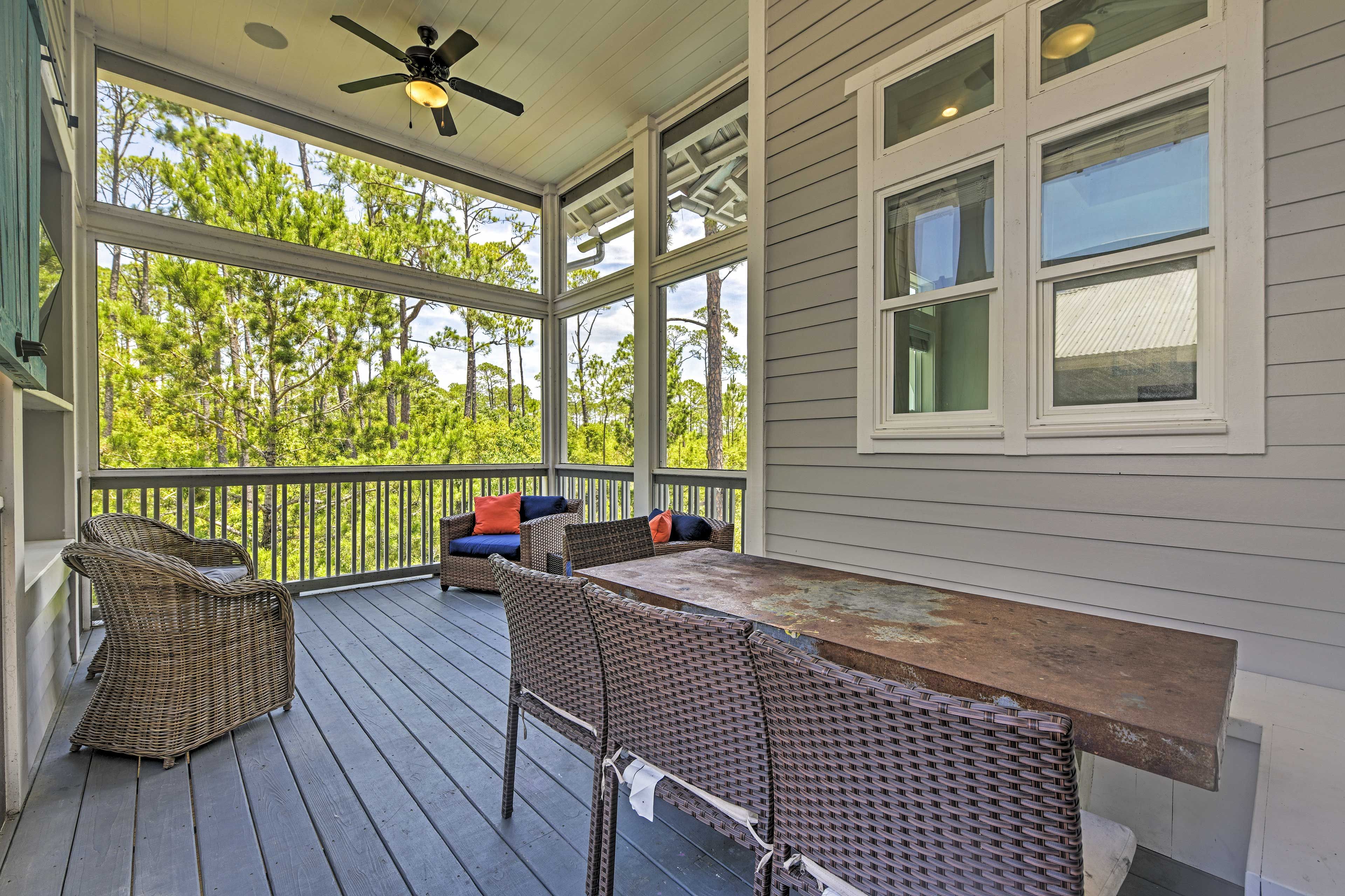 Step out to the enclosed sunroom for Barn doors slide over to reveal a Smart TV.