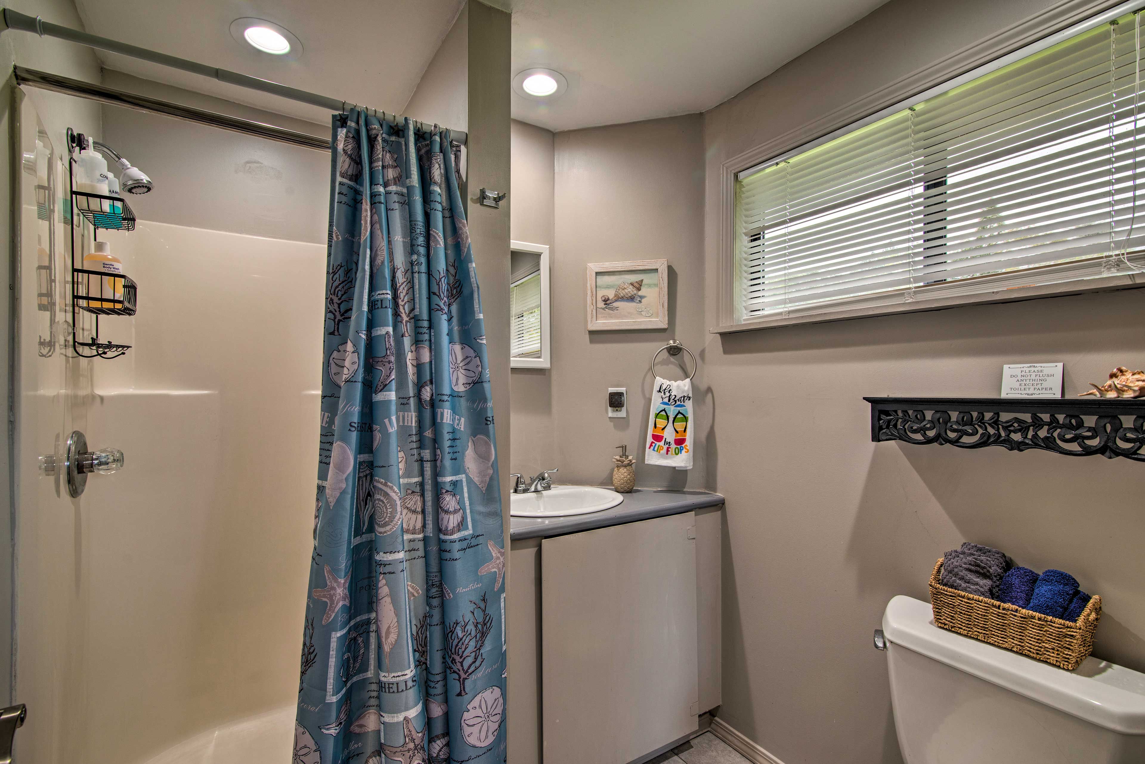 The bathroom has a walk-in shower.
