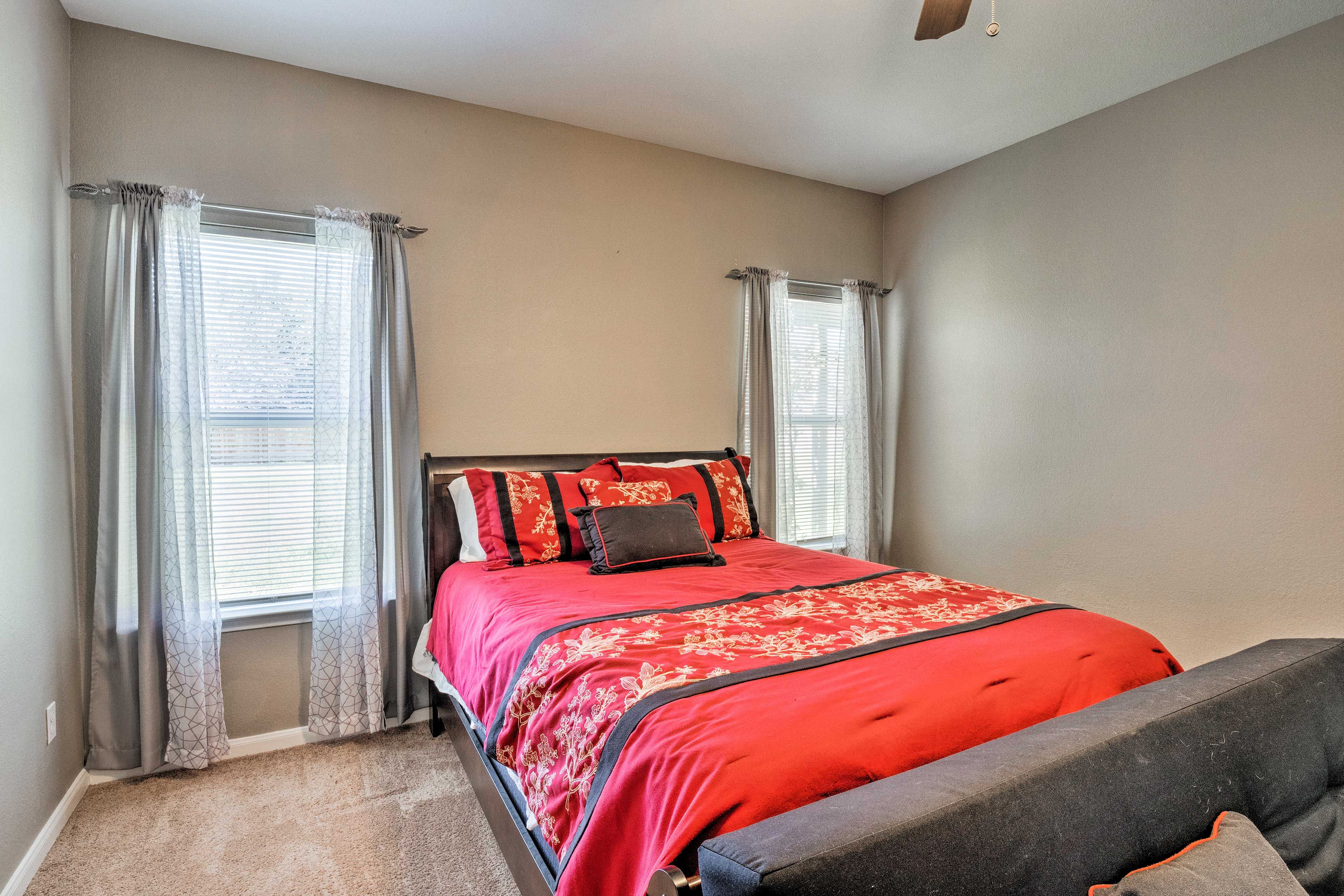 The primary bedroom features a queen bed, futon, and sleeper sofa.