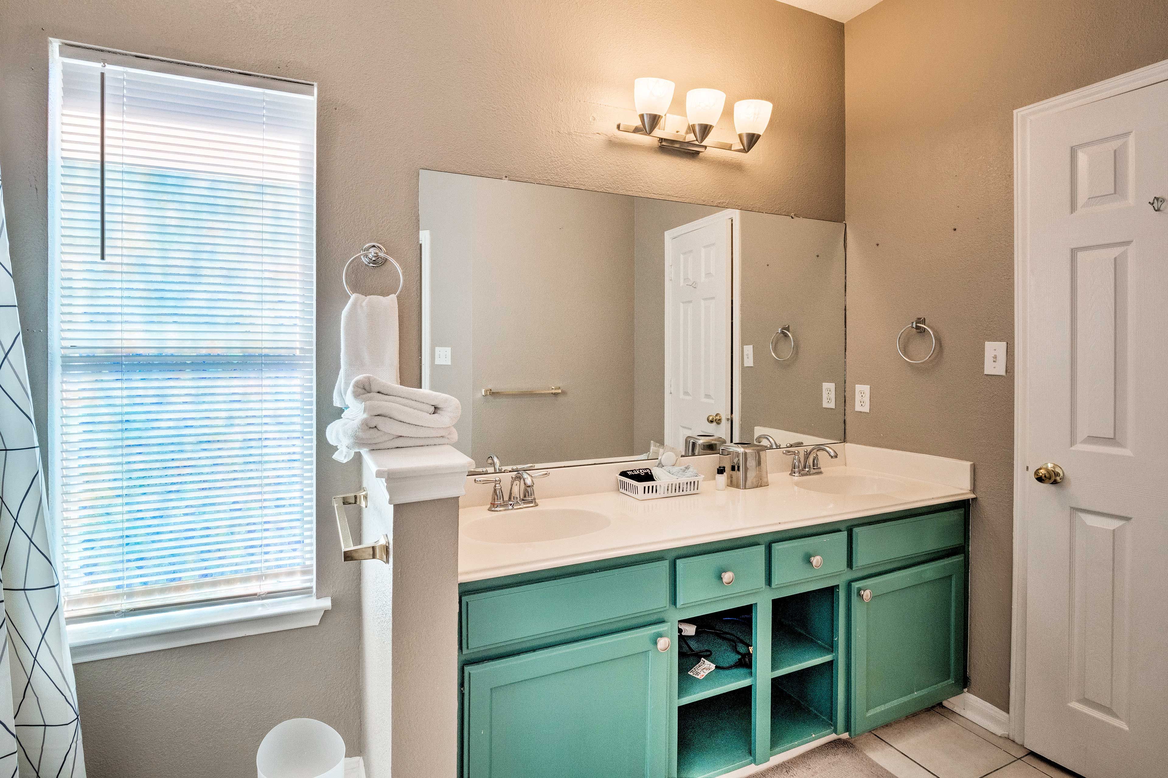 2 can get ready for the day at the dual bathroom vanity.