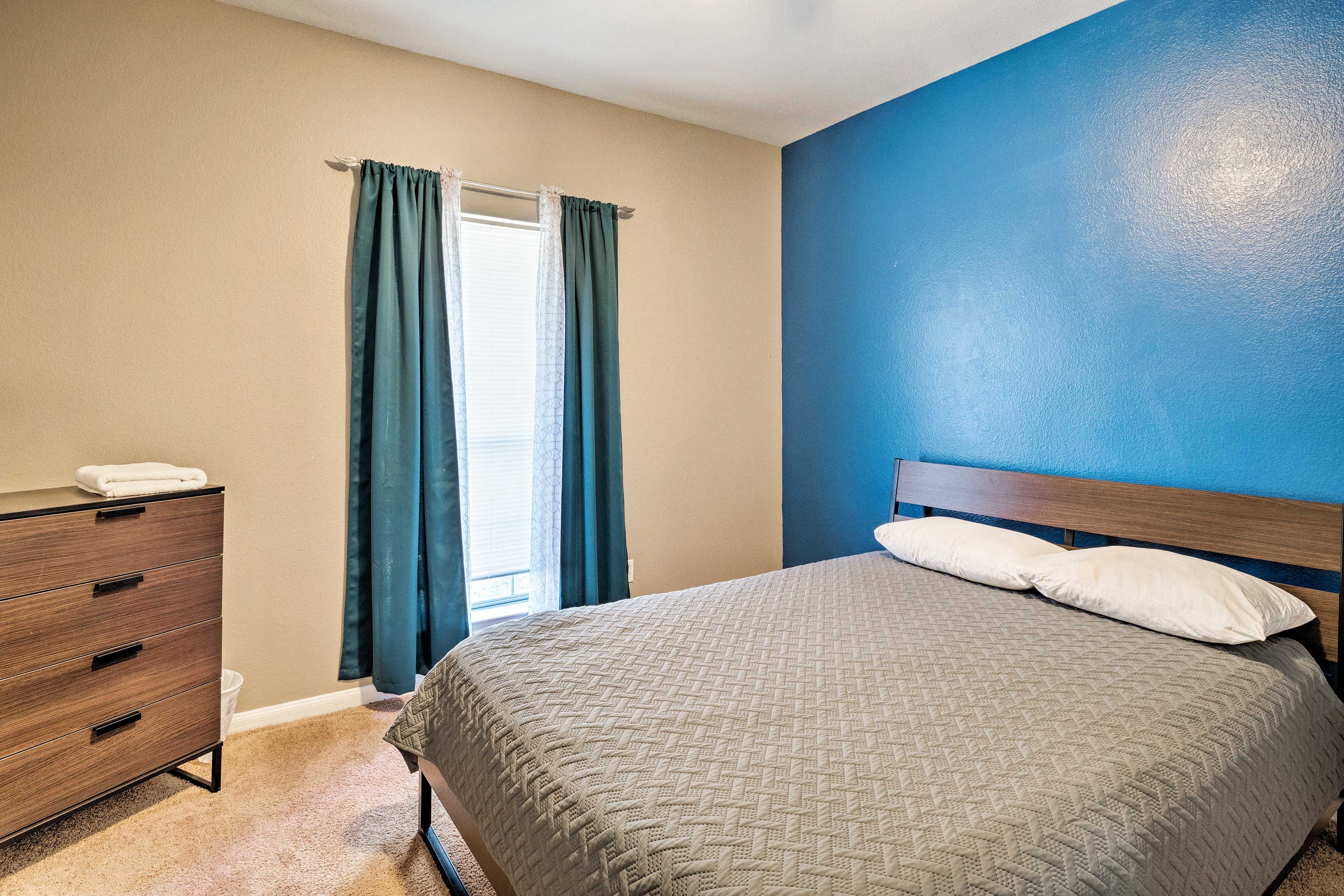 This second bedroom features a queen-sized bed.