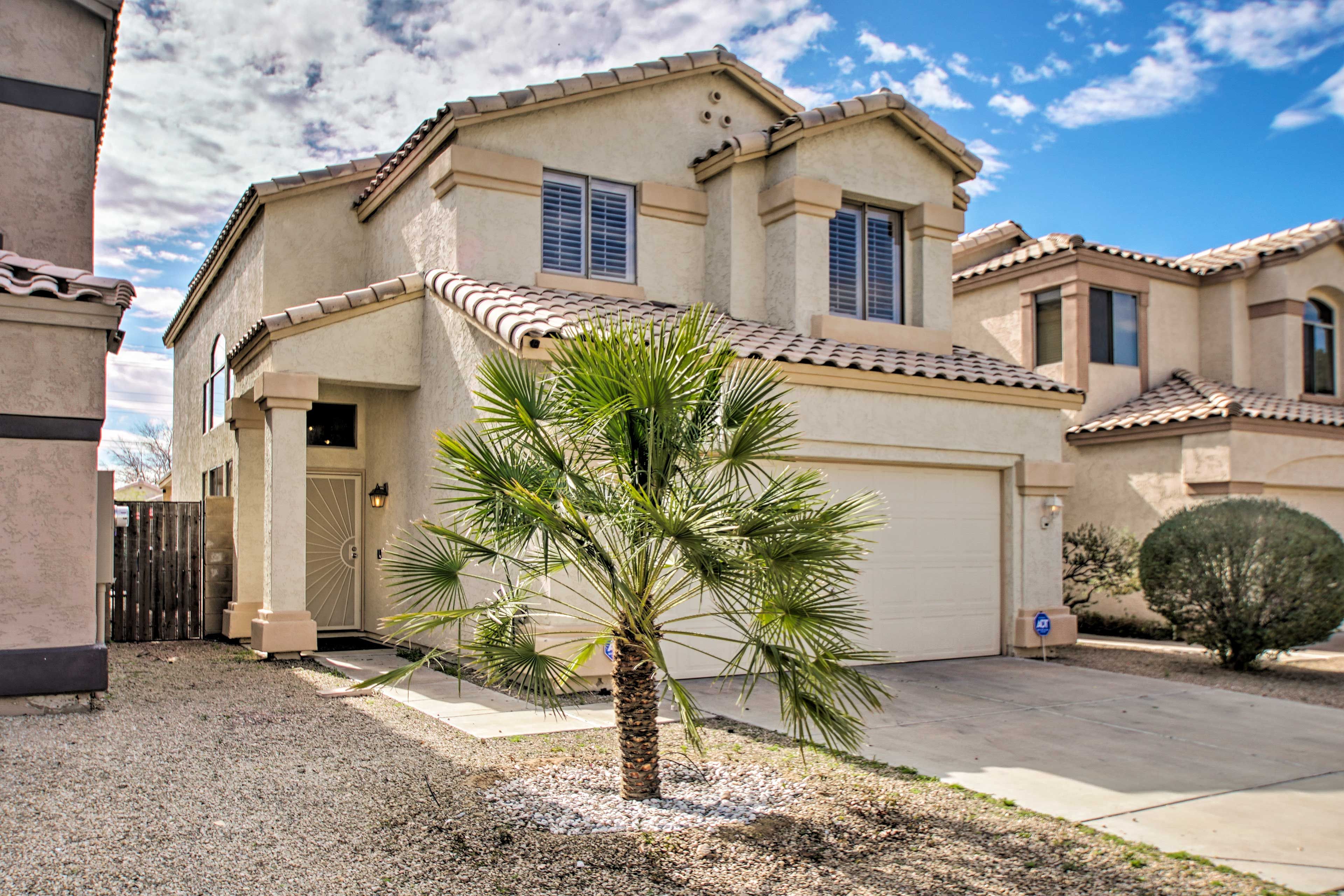 Desert sun and vegetation await at this 2-bedroom, 2.5-bathroom home.