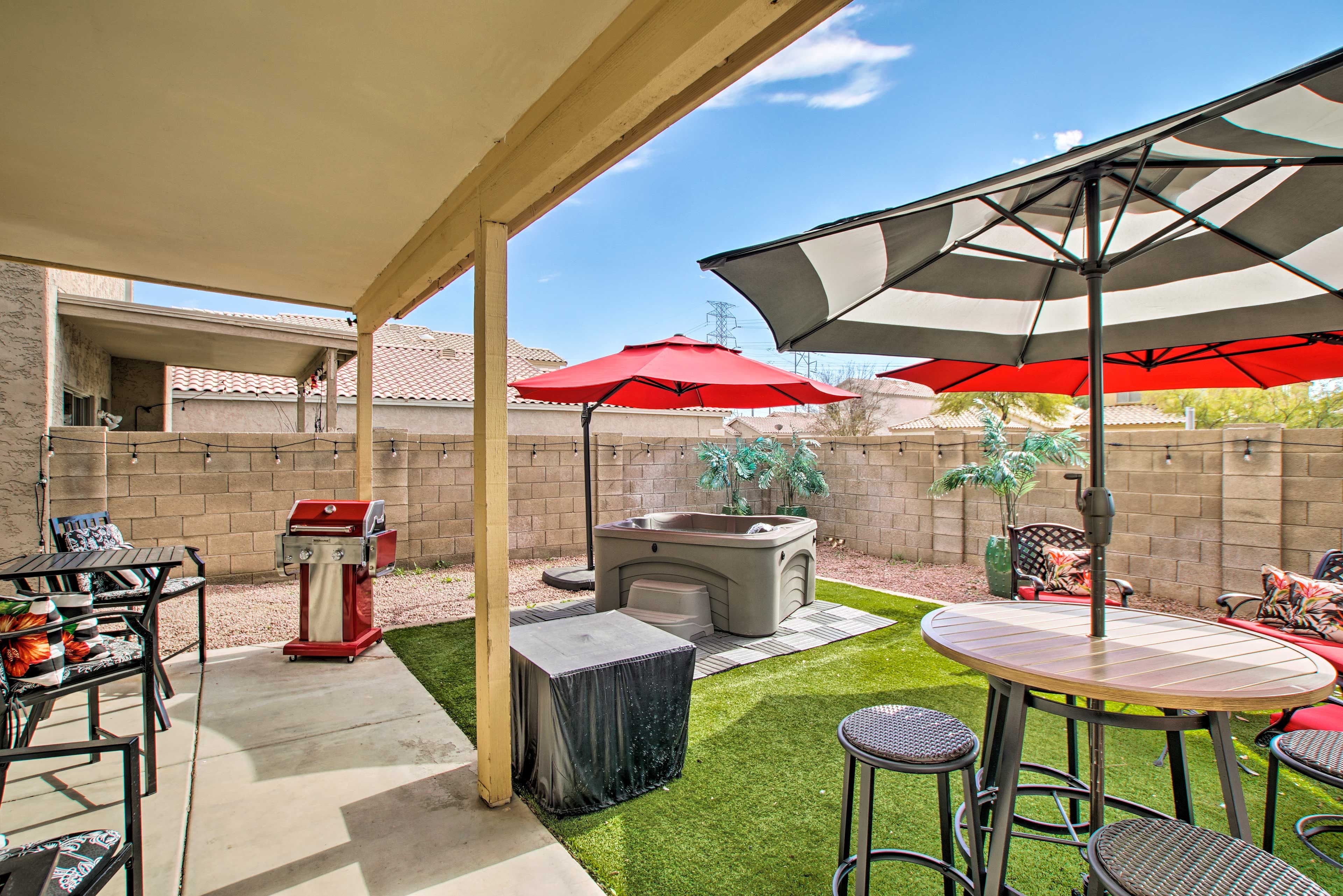The private back yard features plenty of seating and sun shades.