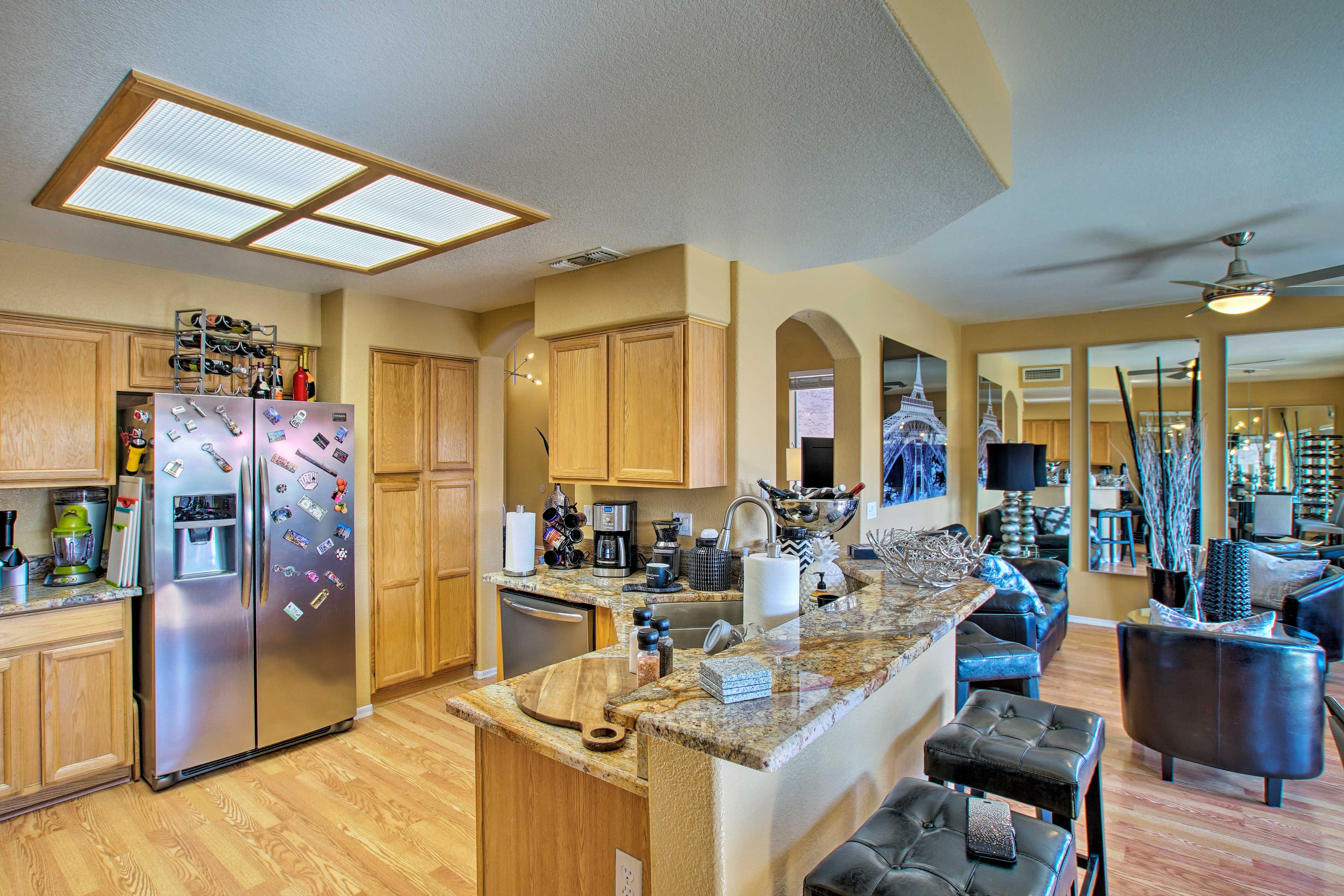The kitchen is fully equipped with stainless steel appliances.