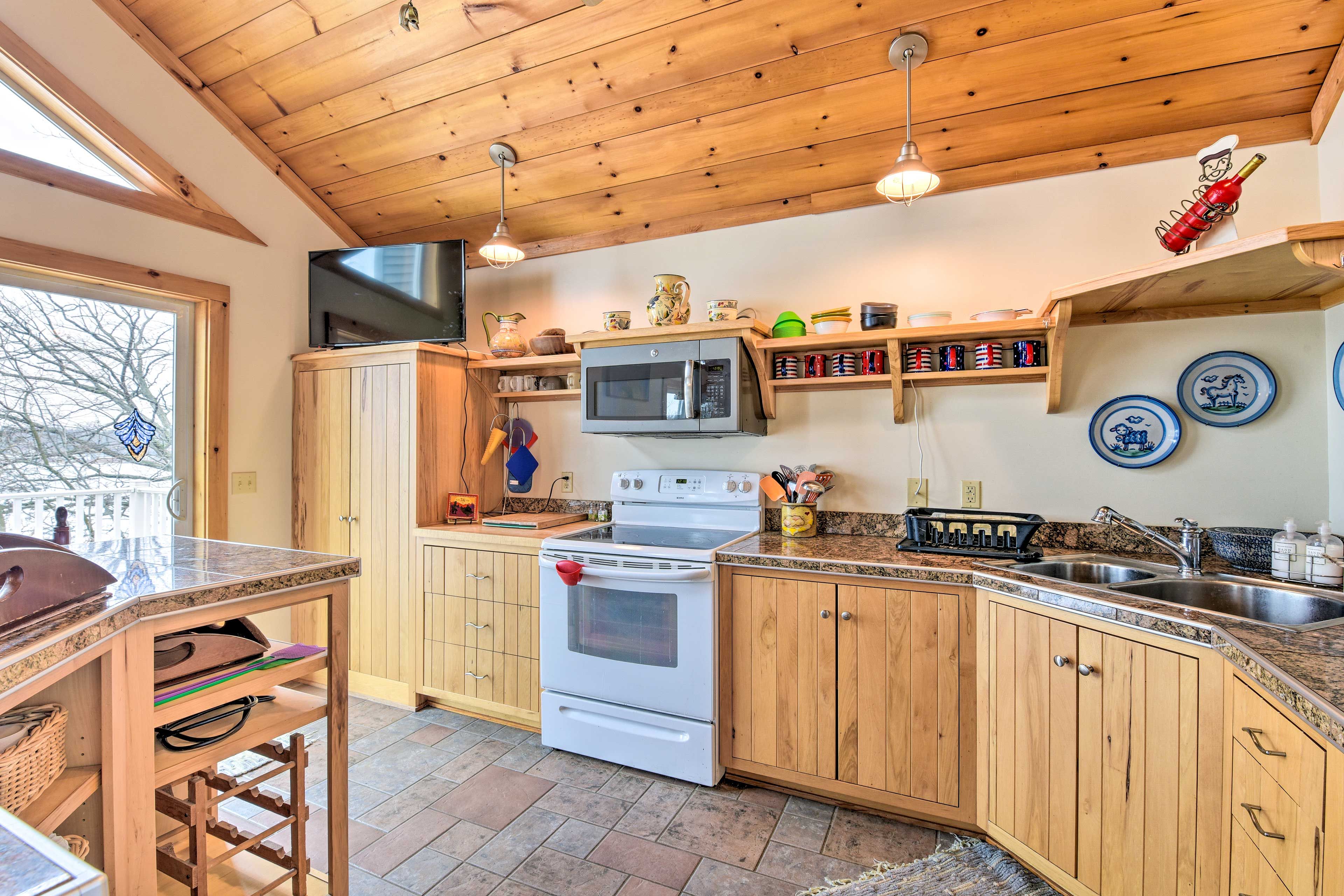 This kitchen is well equipped and stocked with cooking basics.