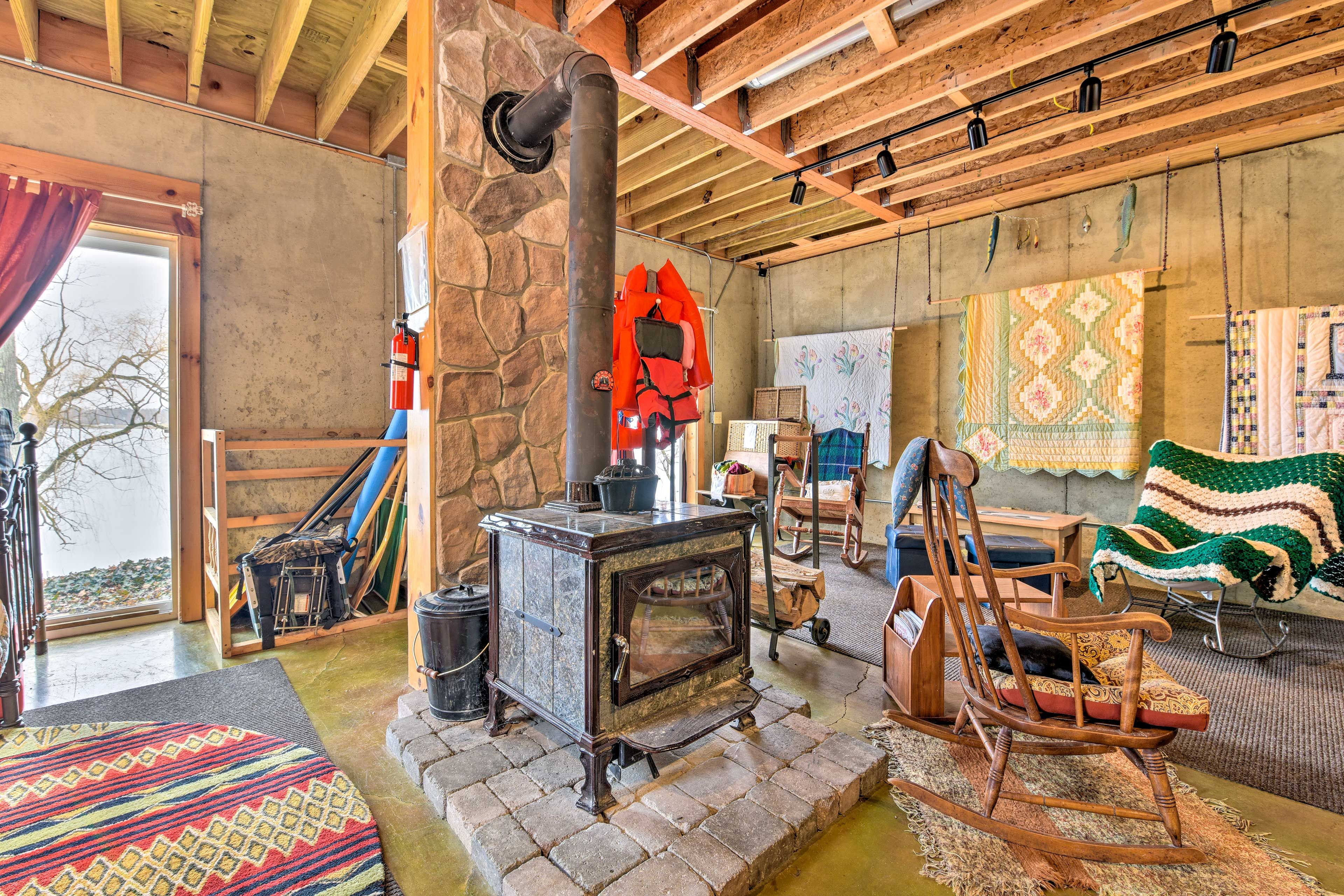 The downstairs family room is equipped with a wood-burning stove.