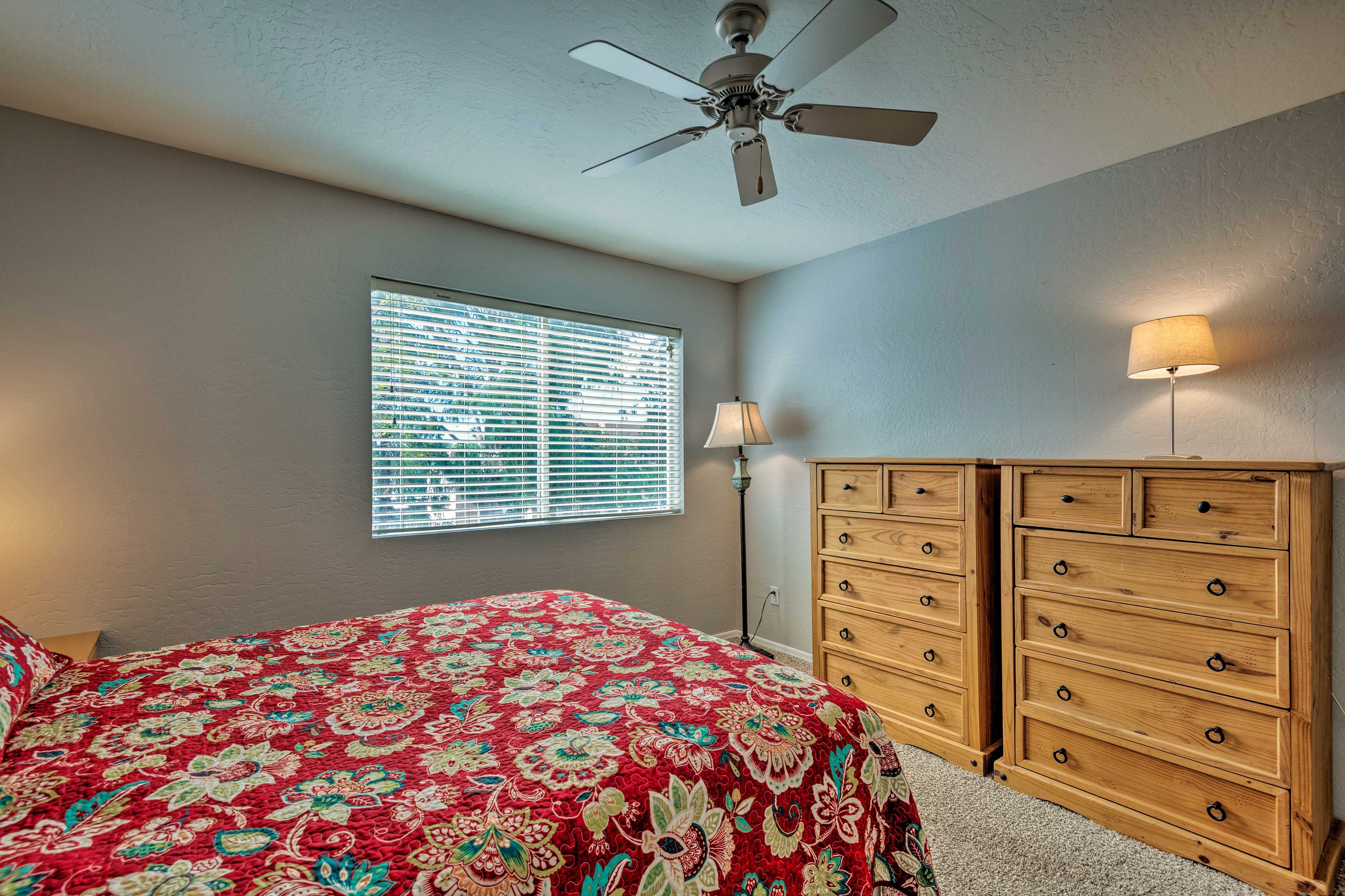 The room includes a queen bed.