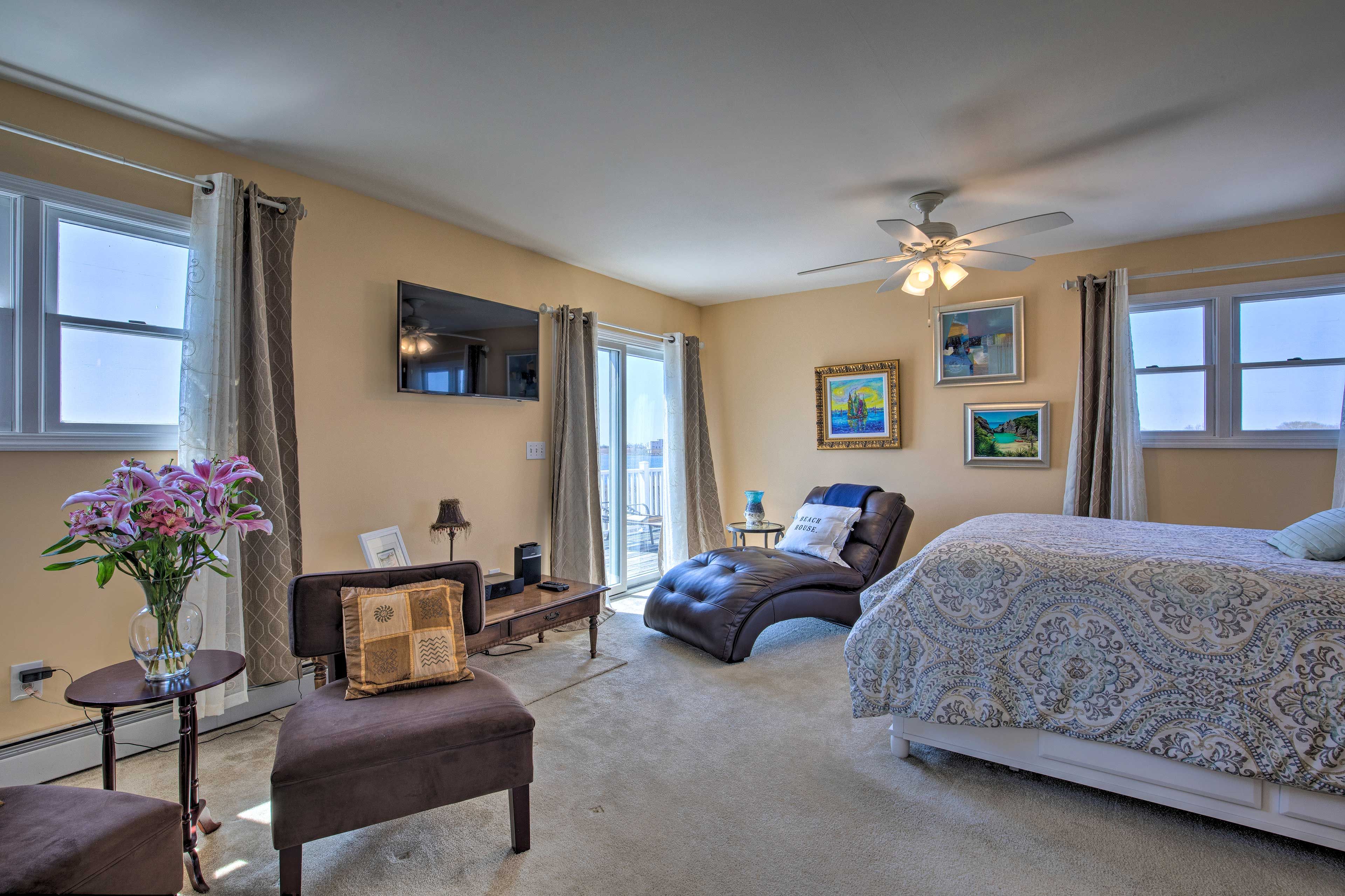 Bedroom 1 | 2nd Floor | Queen Bed | Sitting Area | Deck Access | A/C Unit