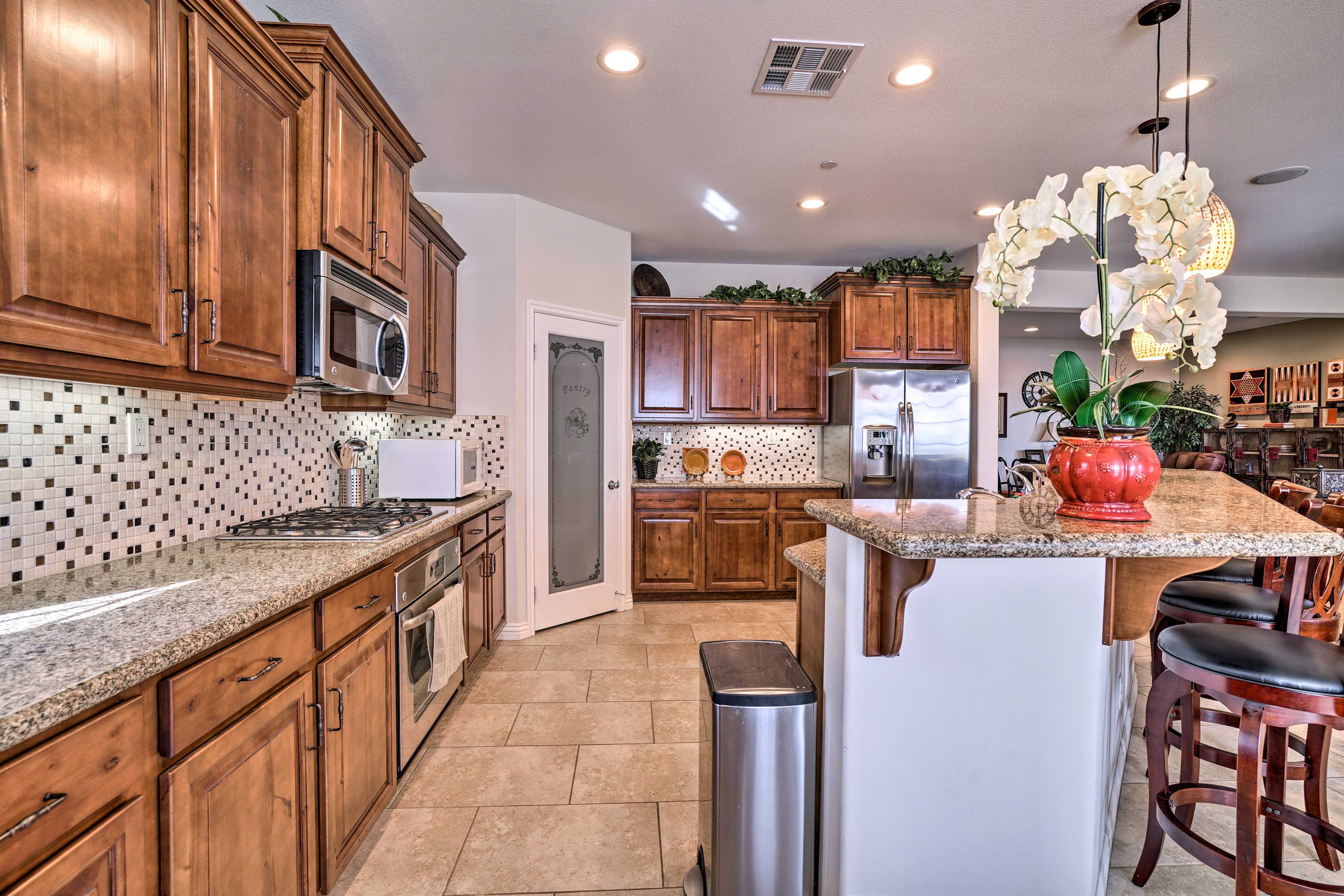 The fully equipped kitchen includes a large pantry.