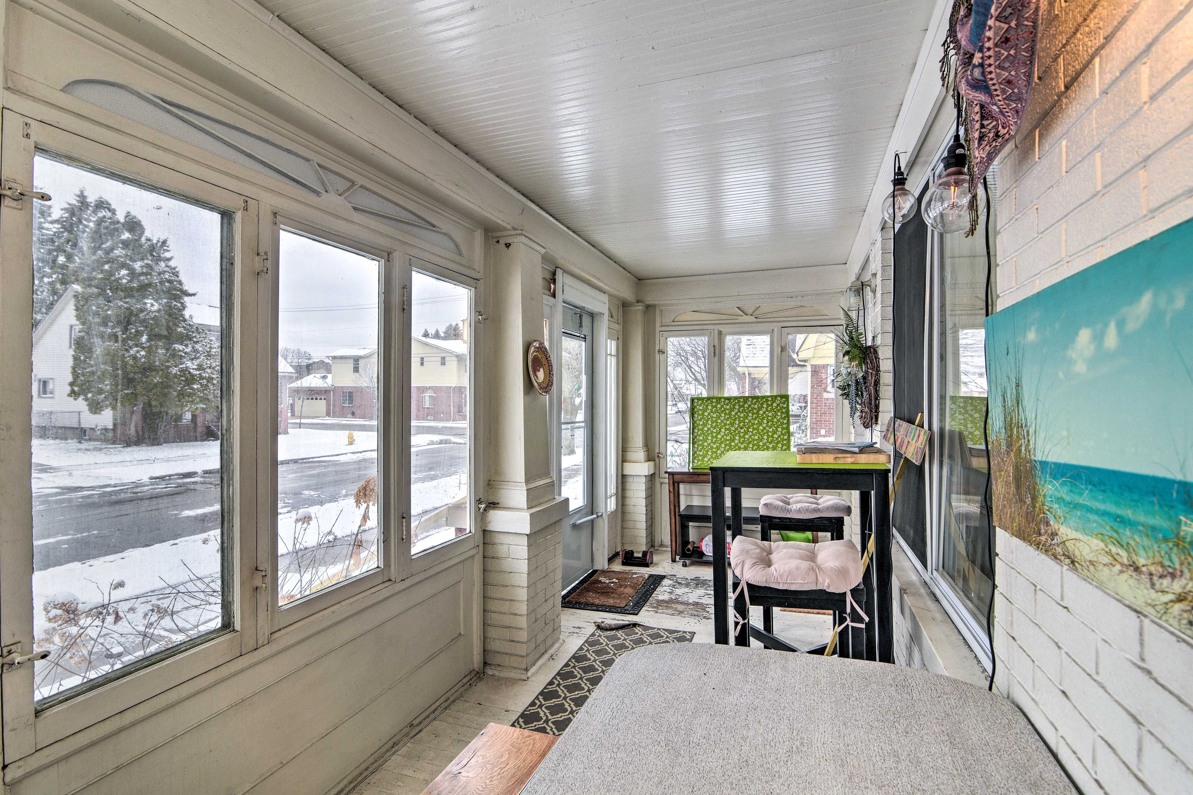 Enjoy meals with a side of natural light in the sunroom.