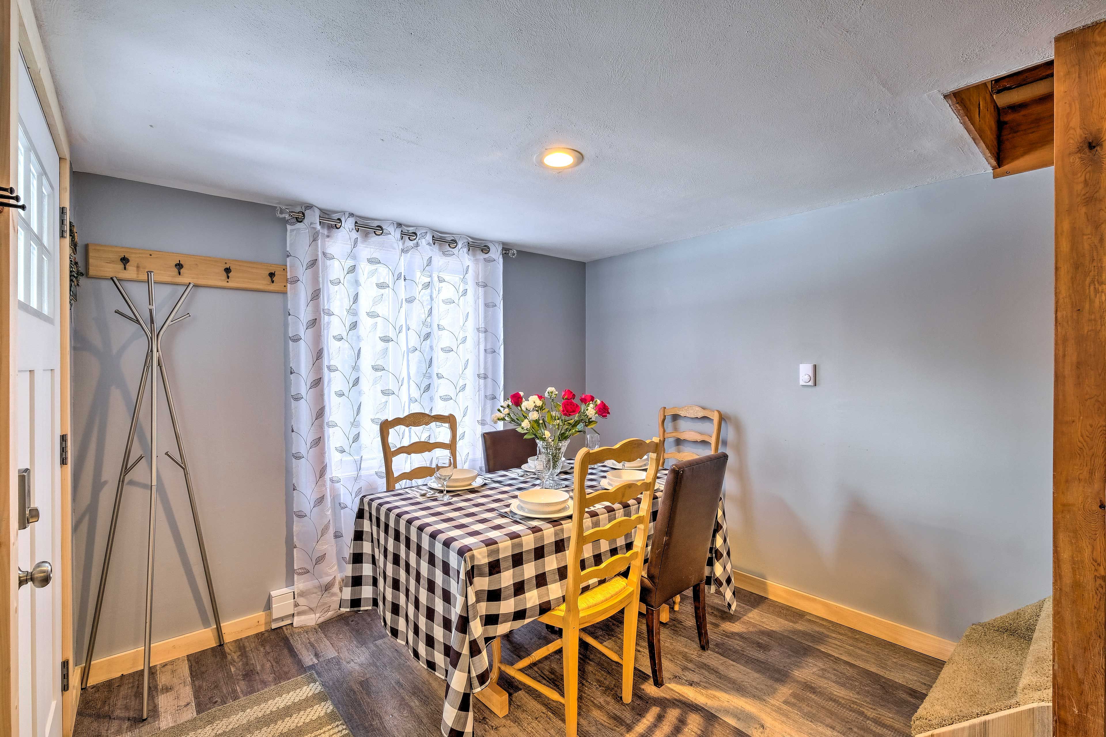 Gather with loved ones around this condo's dining table.