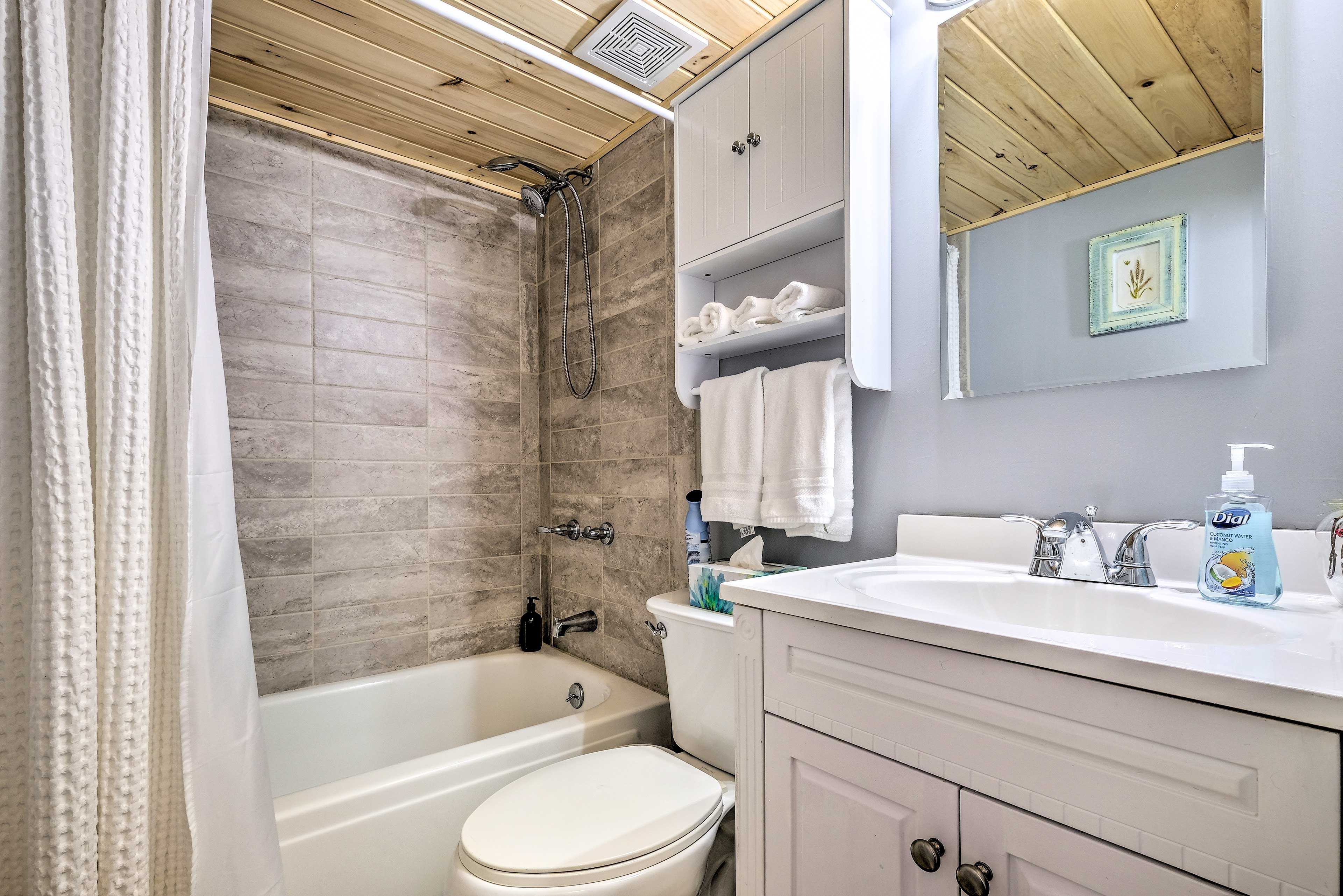Rinse off in the shower/tub combo after a long day outside.