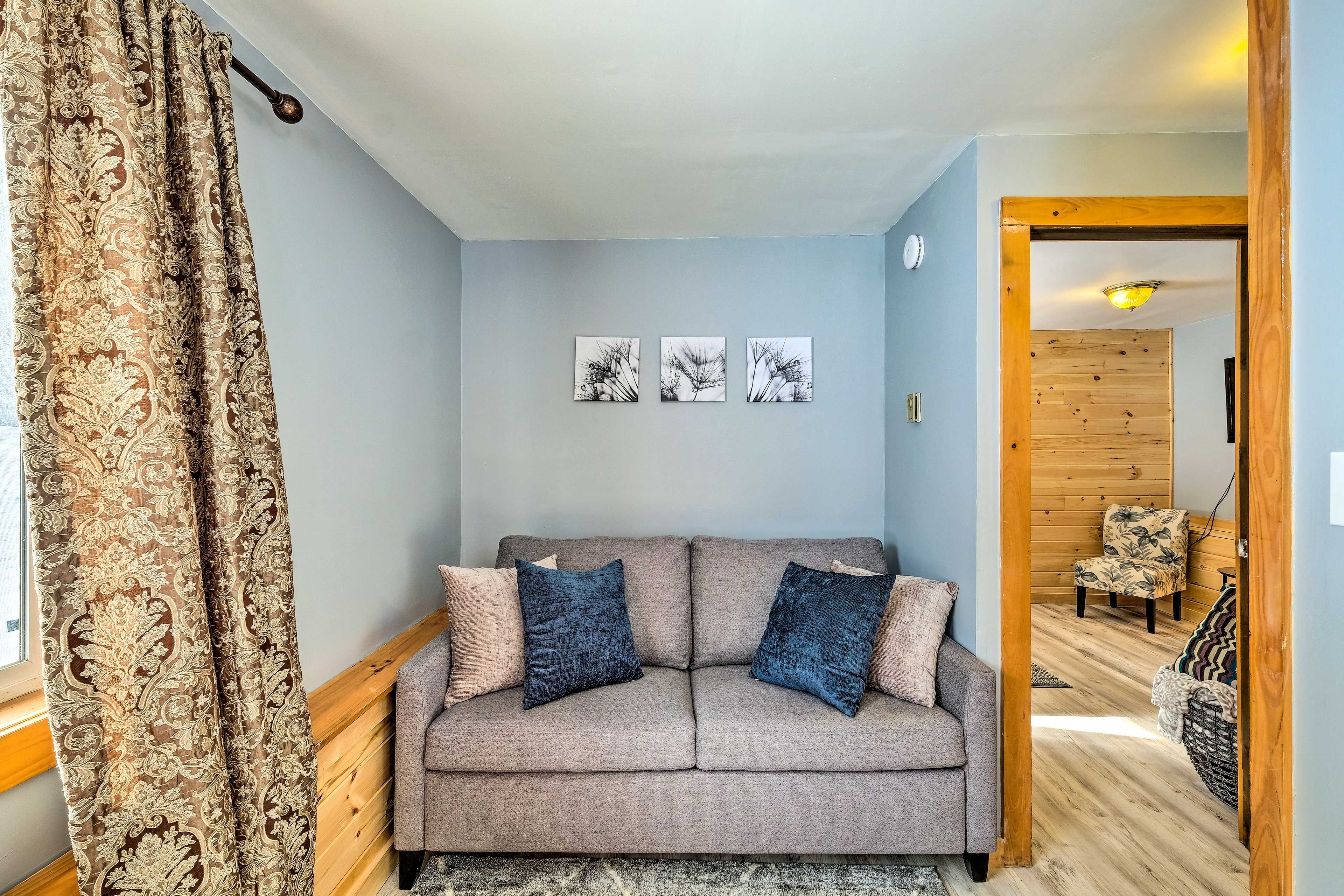 Simple modern decor lines the walls of this vacation rental.