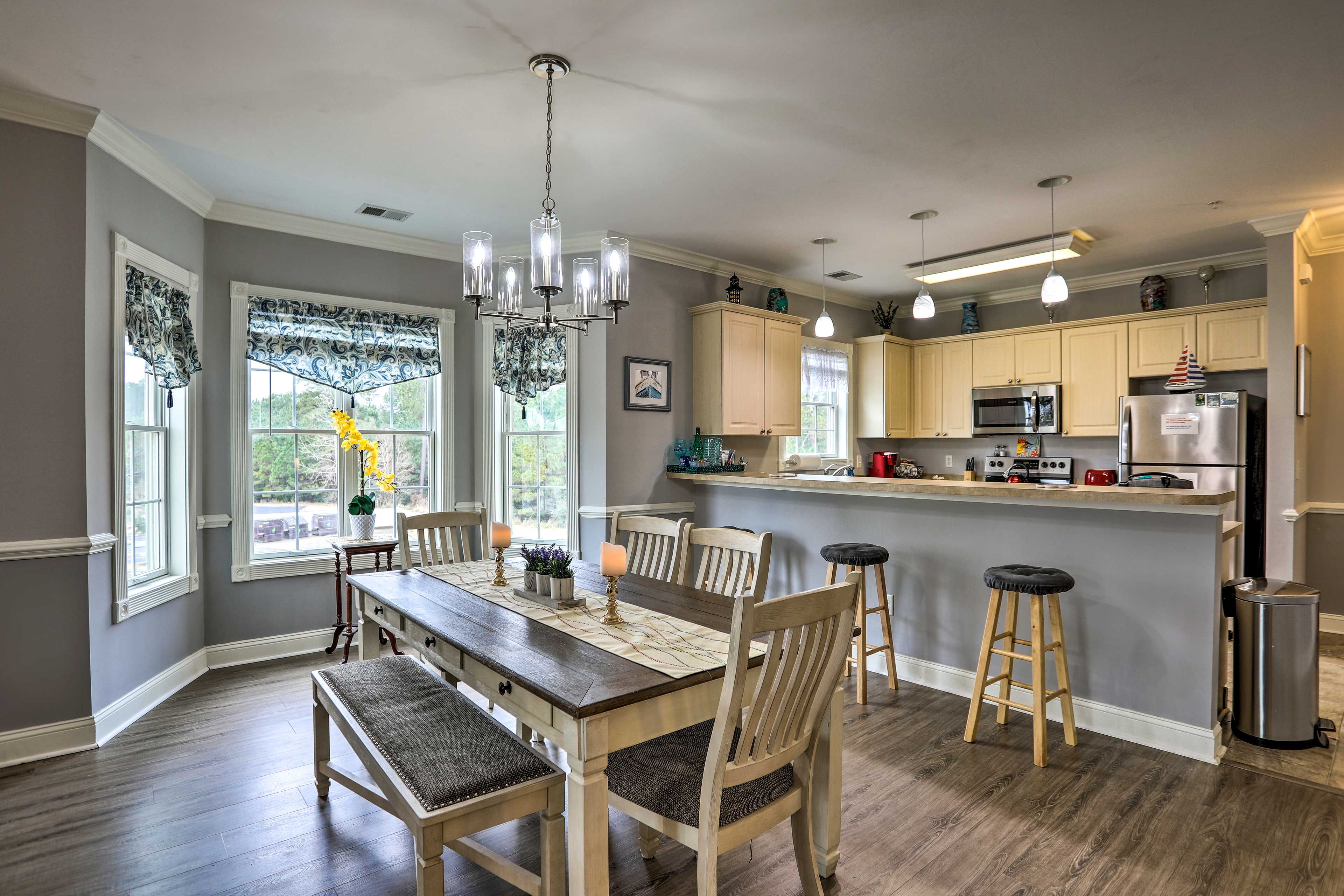 The living room leads into the dining area.