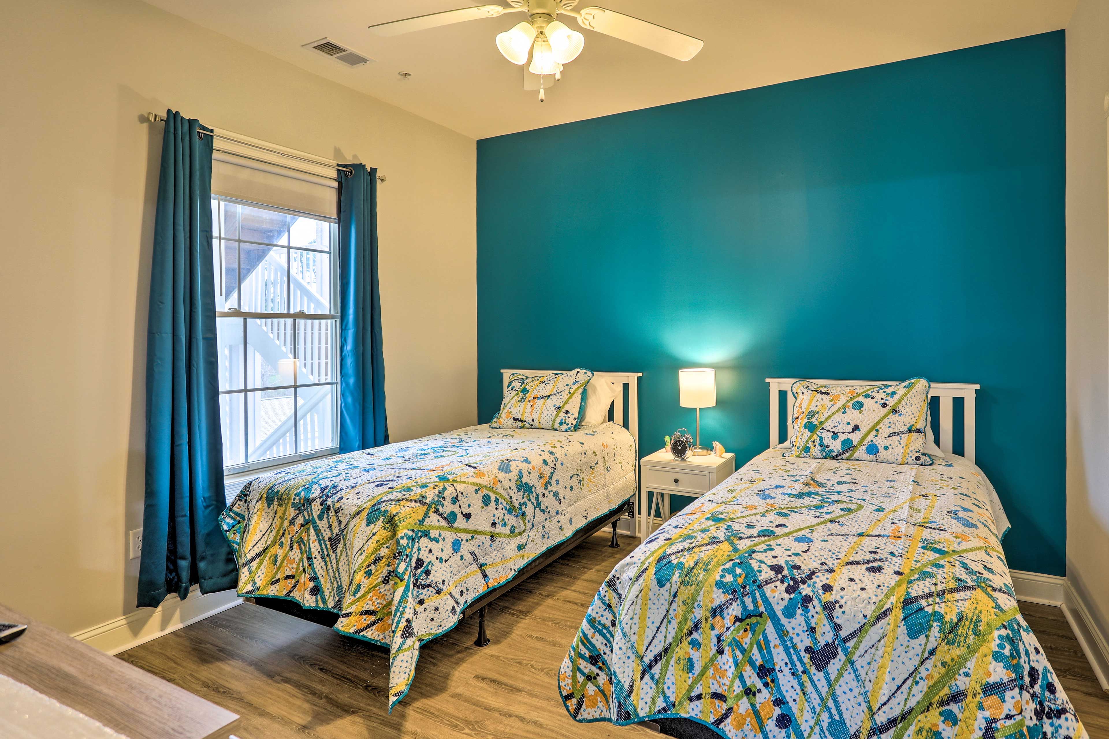 The second bedroom has a pair of twin beds.