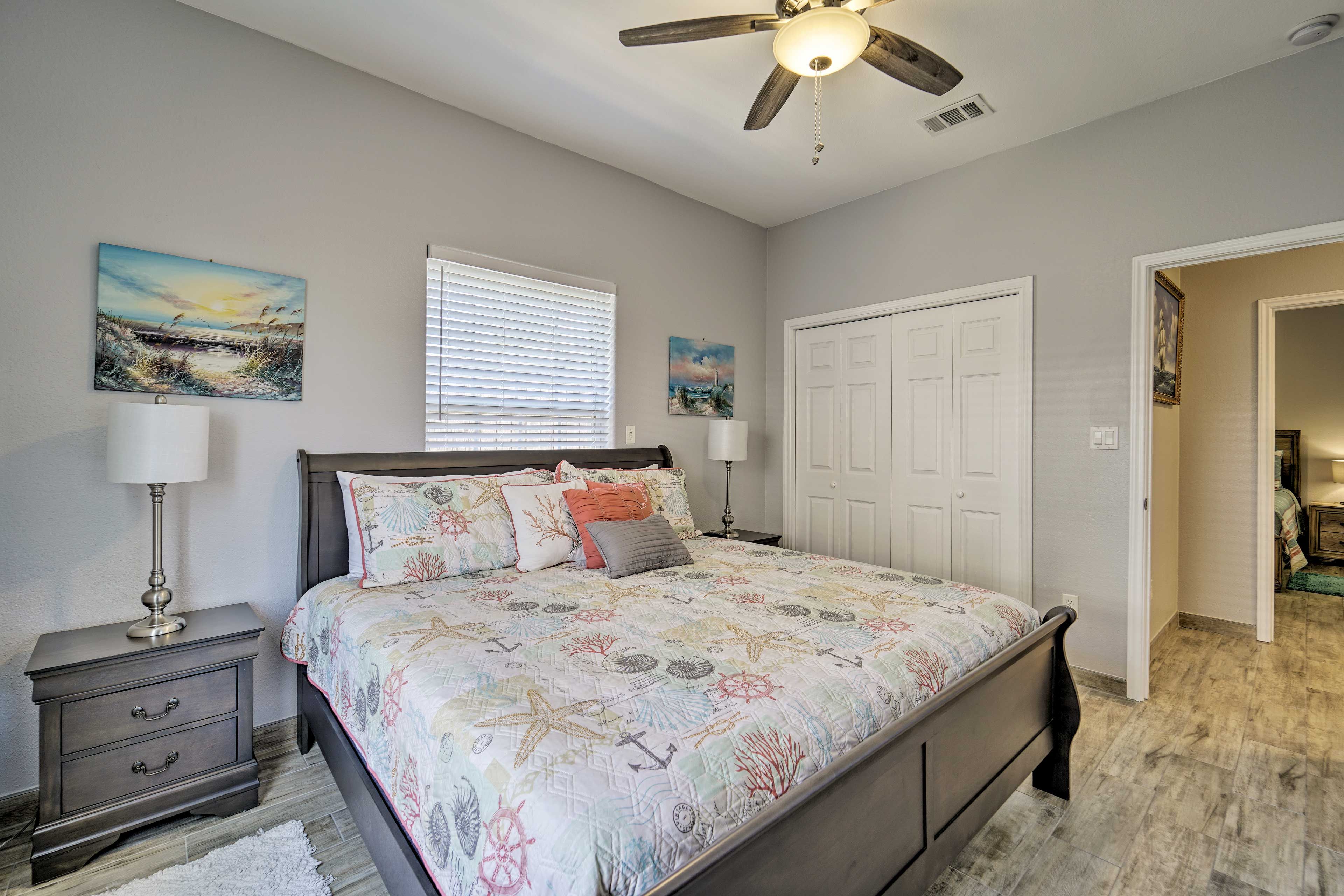 This bedroom boasts a TV and king bed.