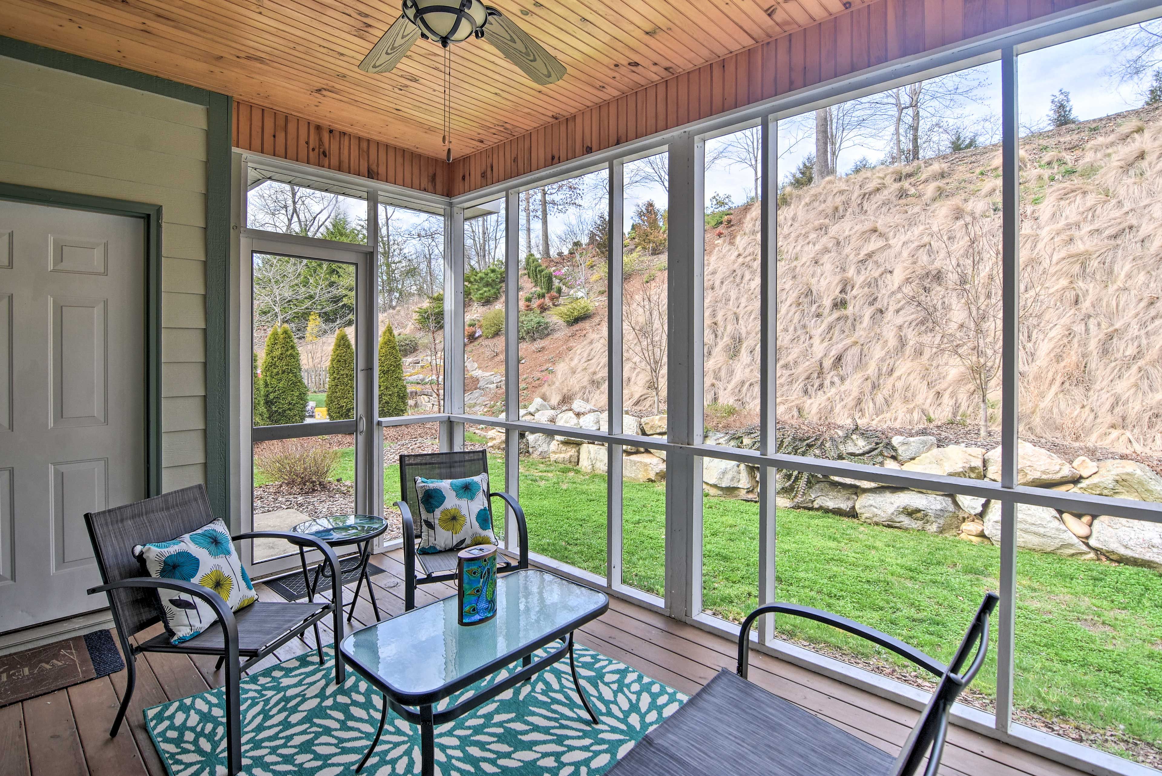 Sip a glass of wine from this vacation rental's screened-in deck!