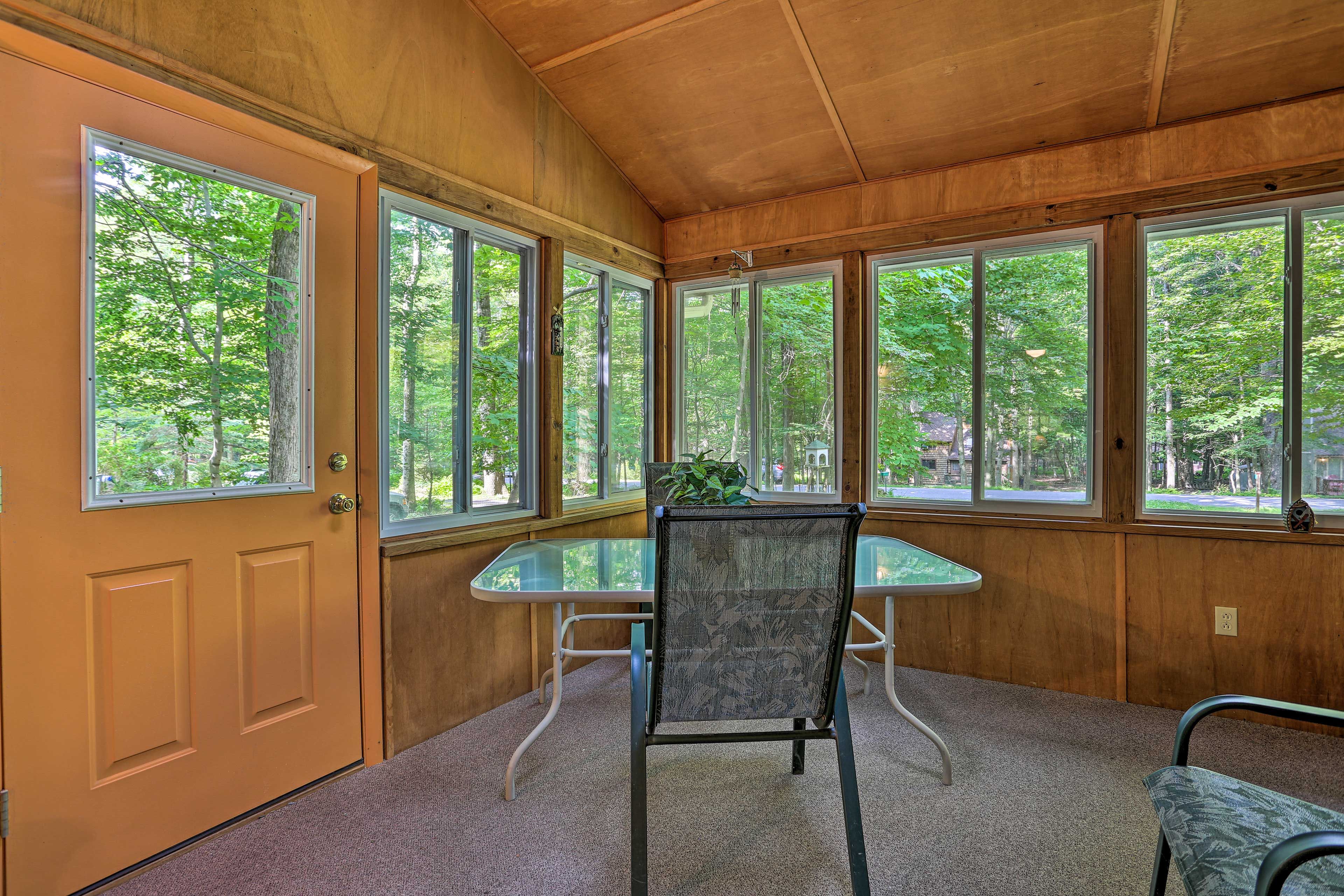 Enjoy the natural light in the sunroom.