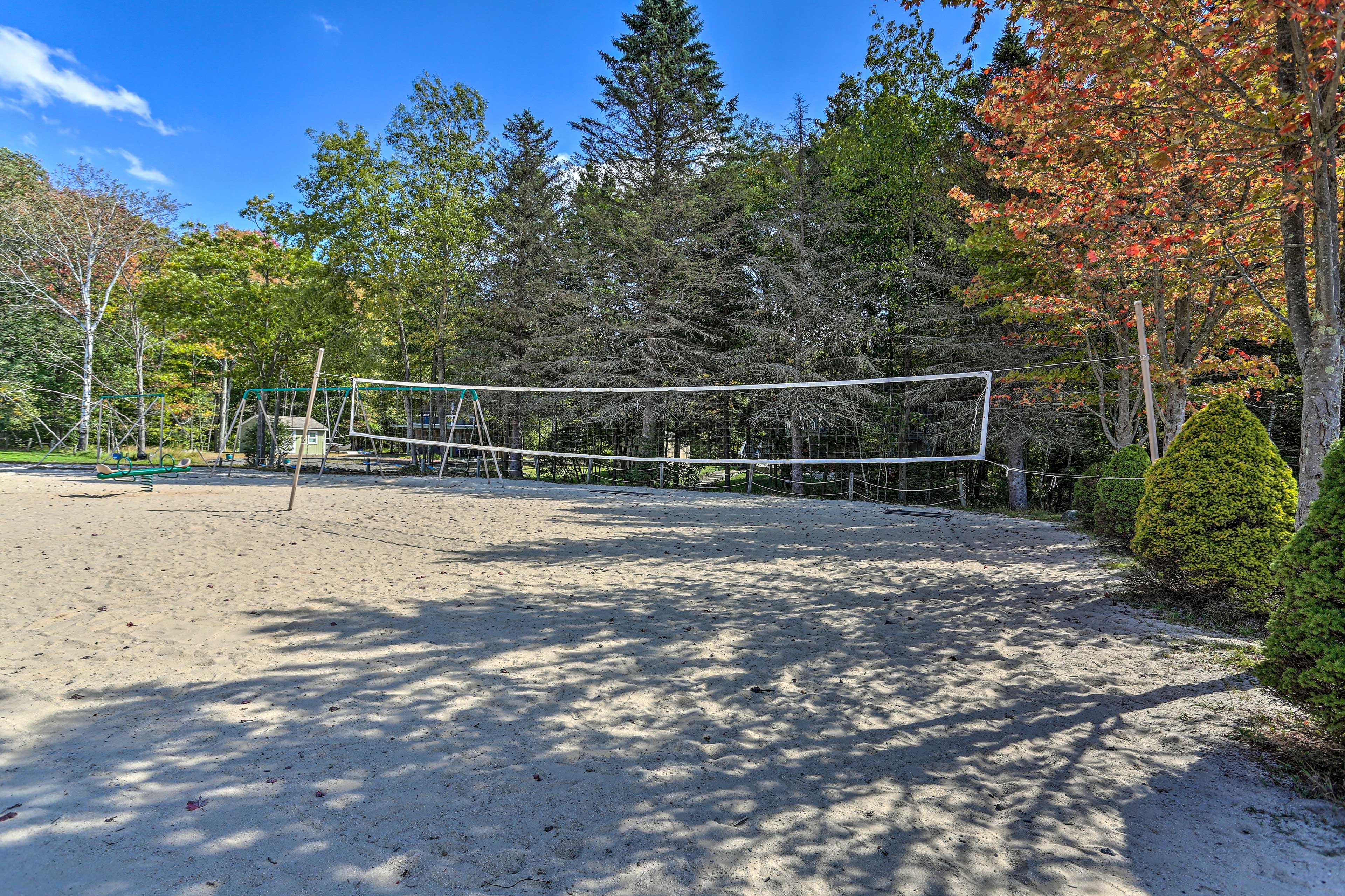 Play some sand volleyball with the group.