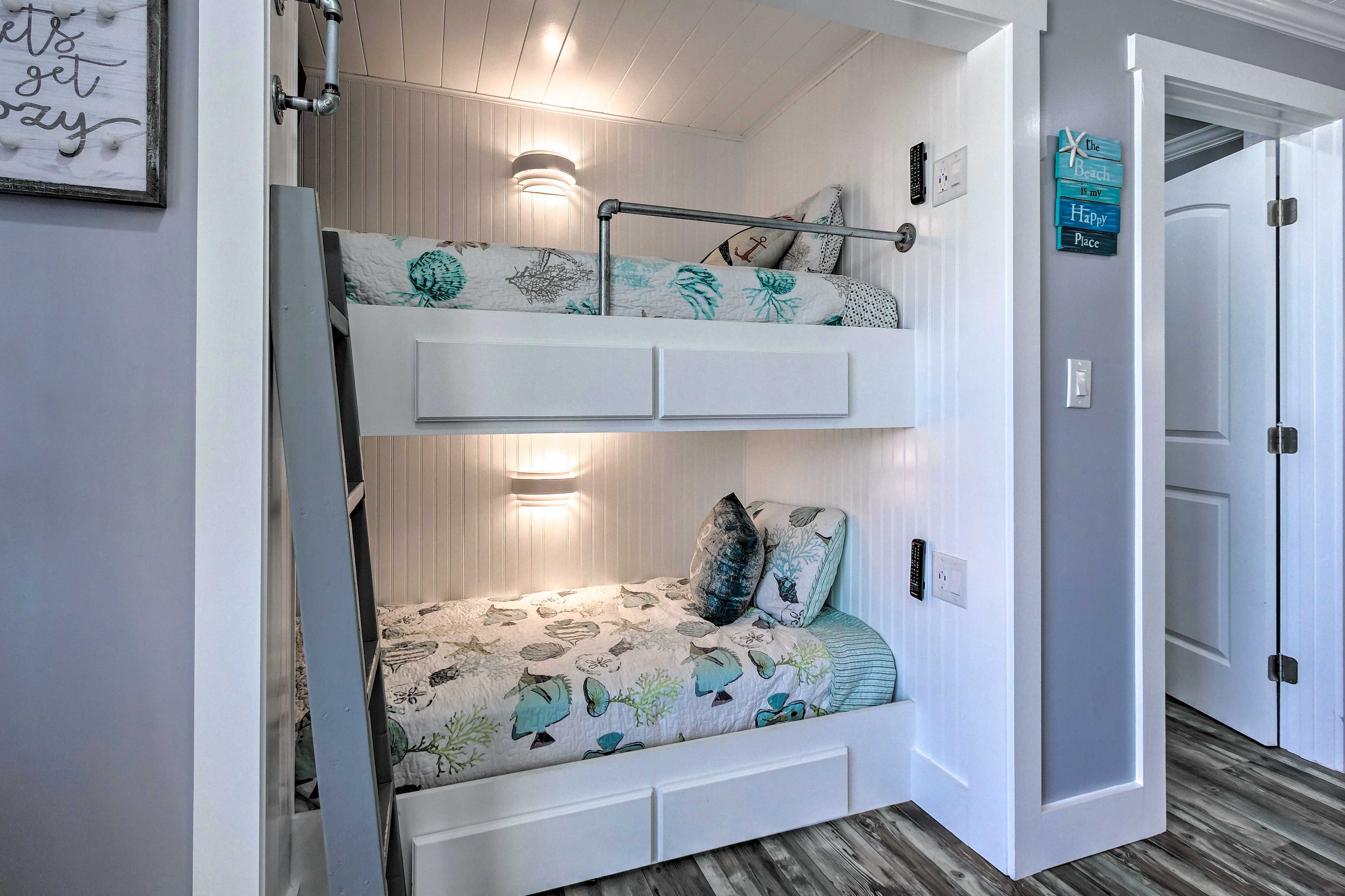 Kids can claim the living room's twin bunk beds.