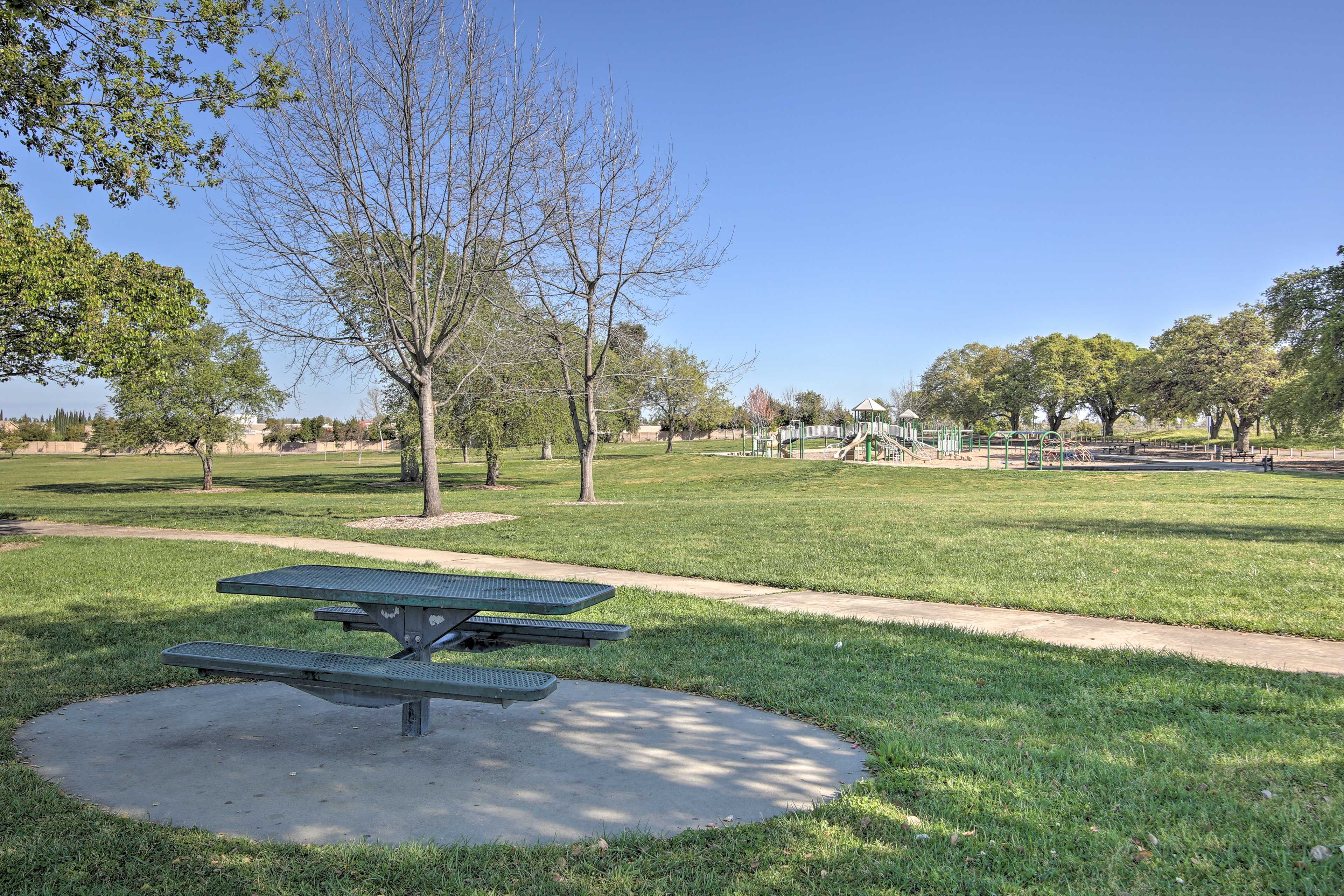 There are plenty of tables for picnics in the park.