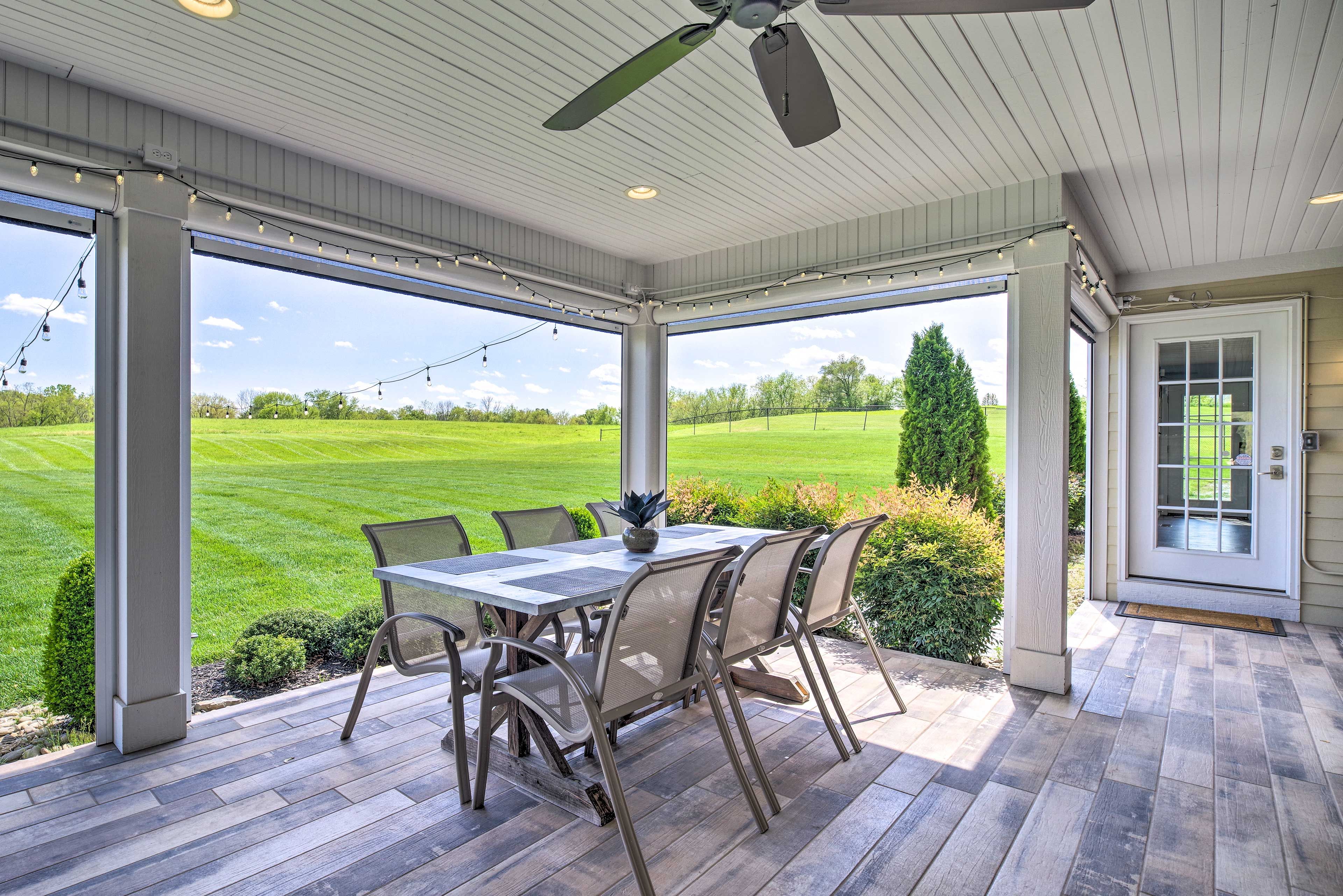 Dine outdoors at the covered porch's patio table.
