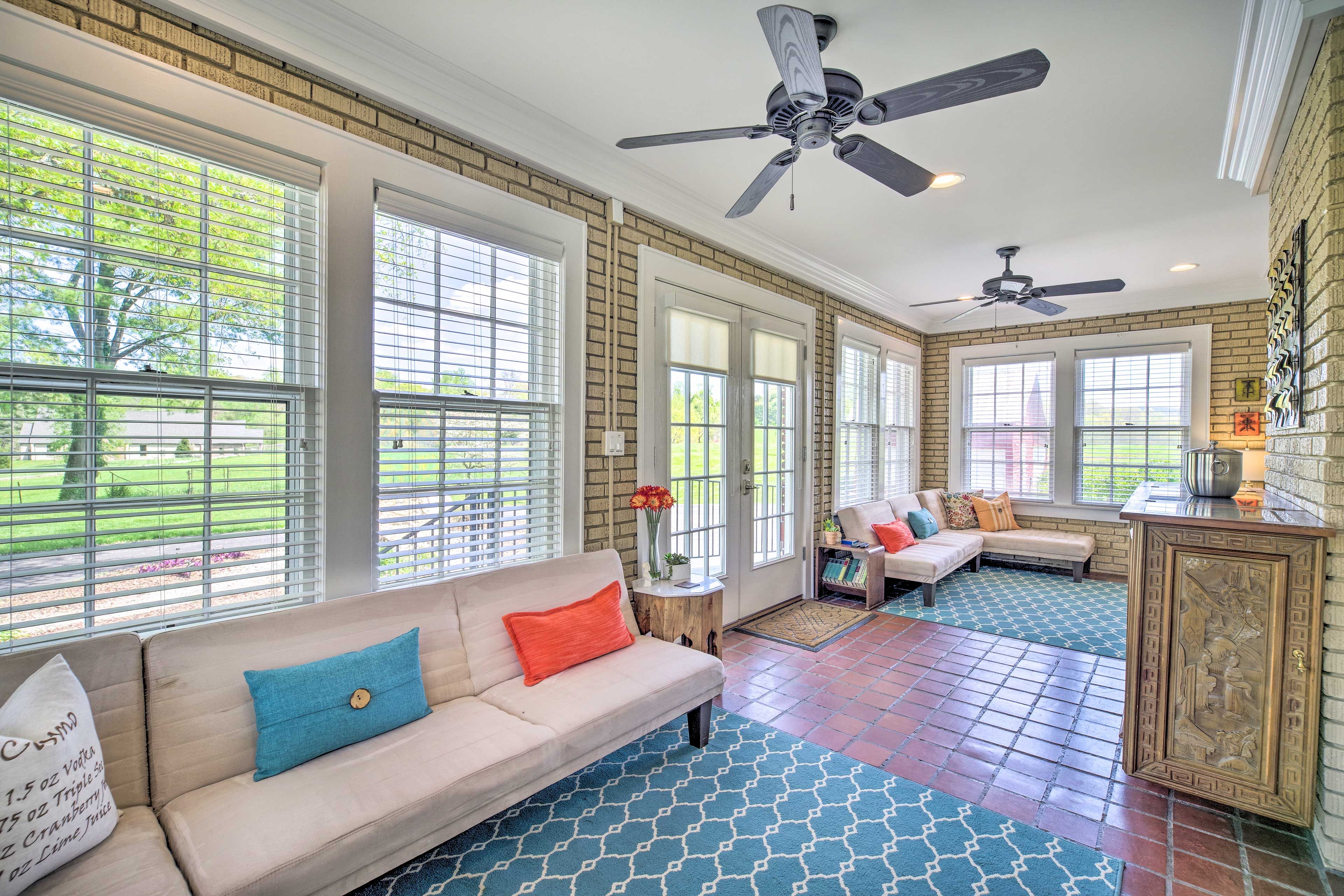 Enjoy natural light as you read in the sunroom.