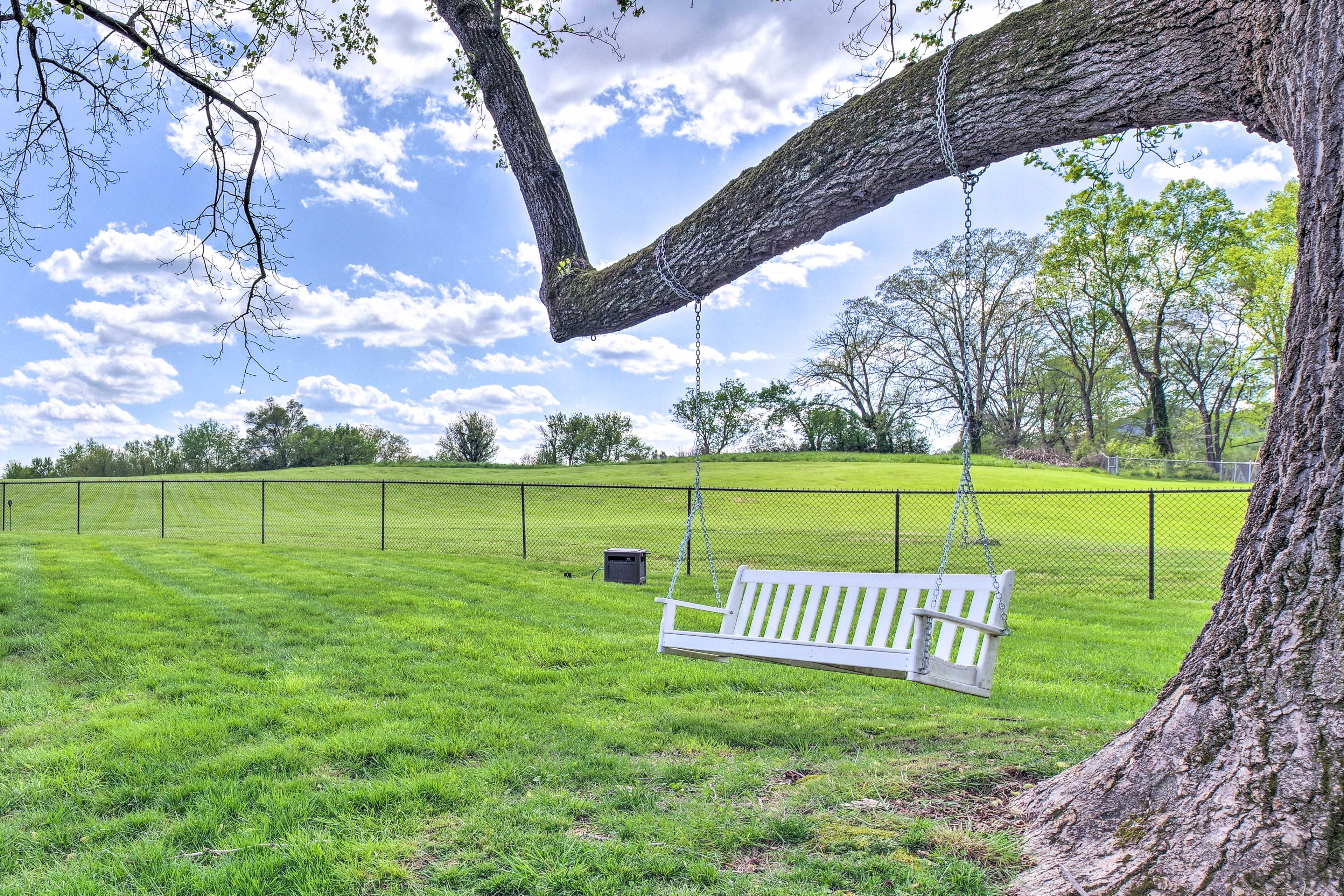 Enjoy a summer breeze as you sit on the swinging bench!