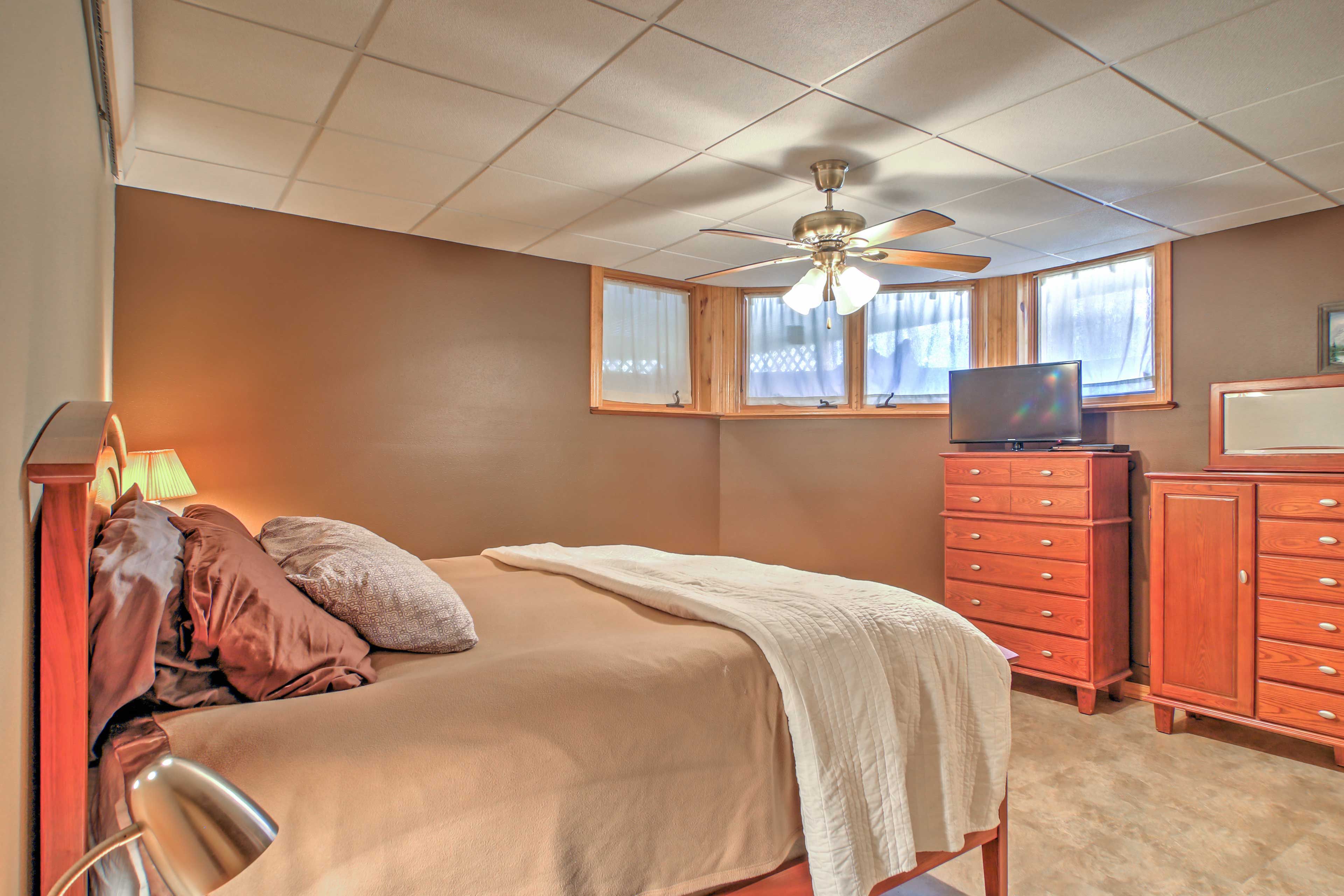 This bedroom includes a flat-screen TV.