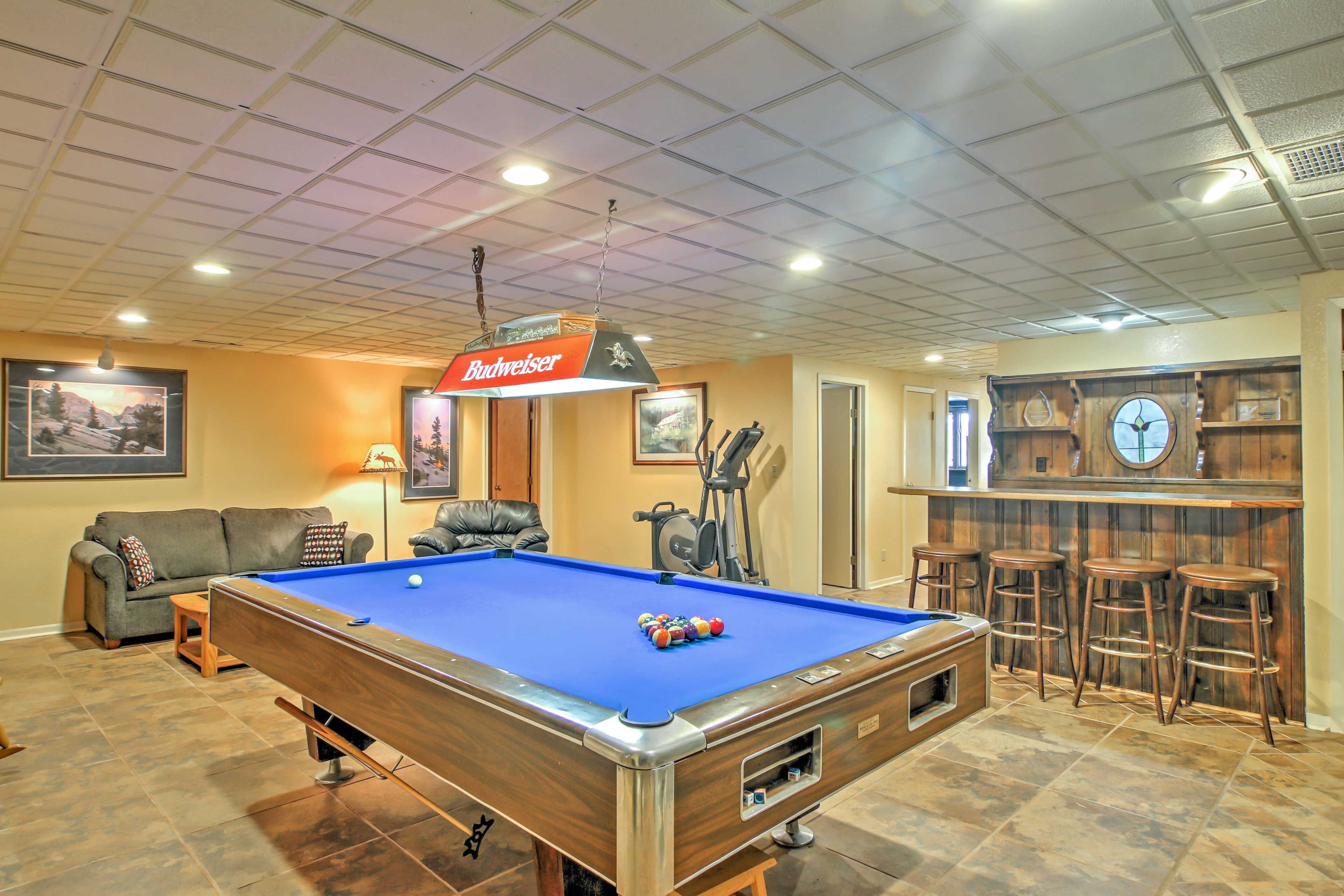 The cabin boasts a game room complete with a pool table and indoor bar.