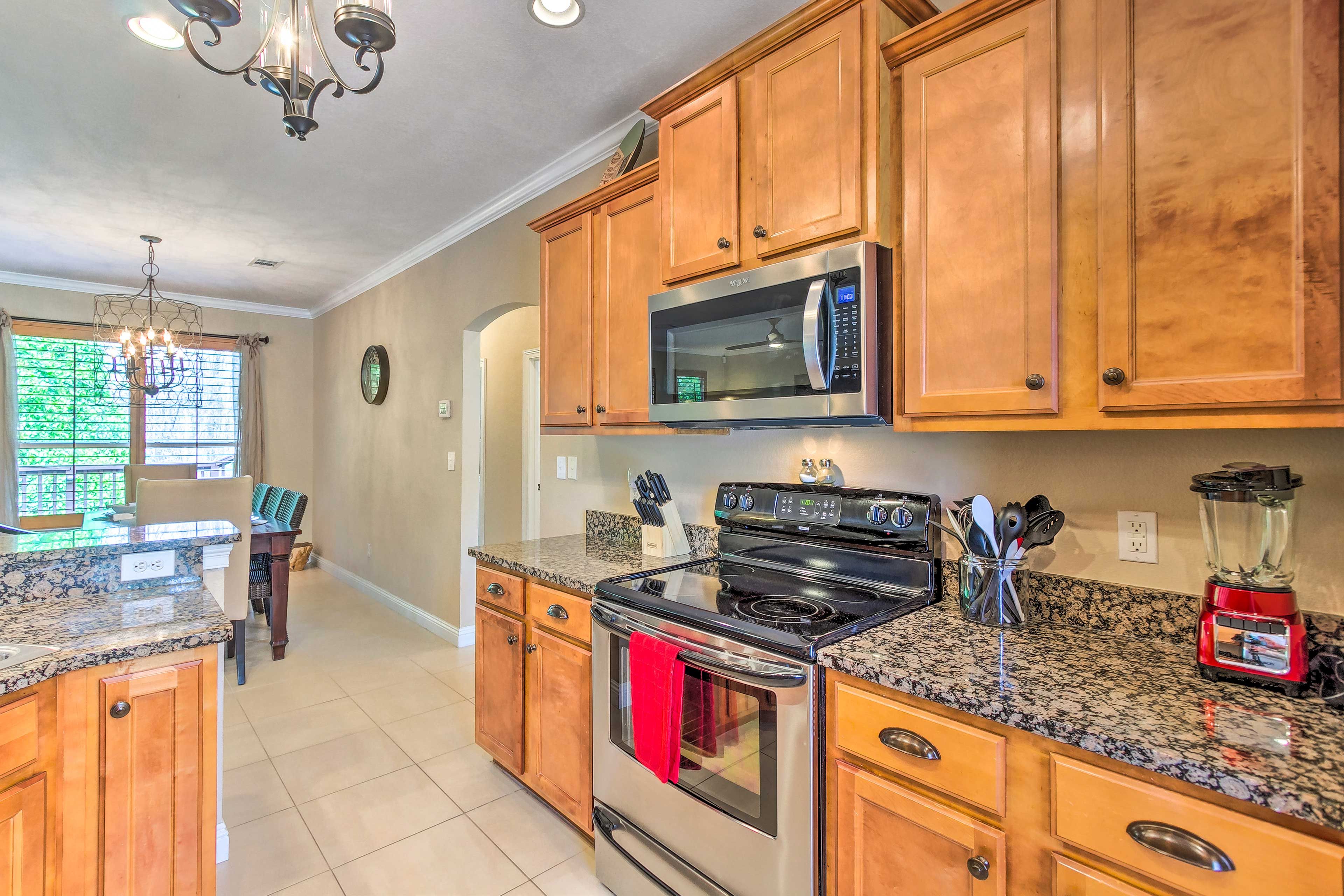 Stainless steel appliances highlight the fully equipped kitchen.