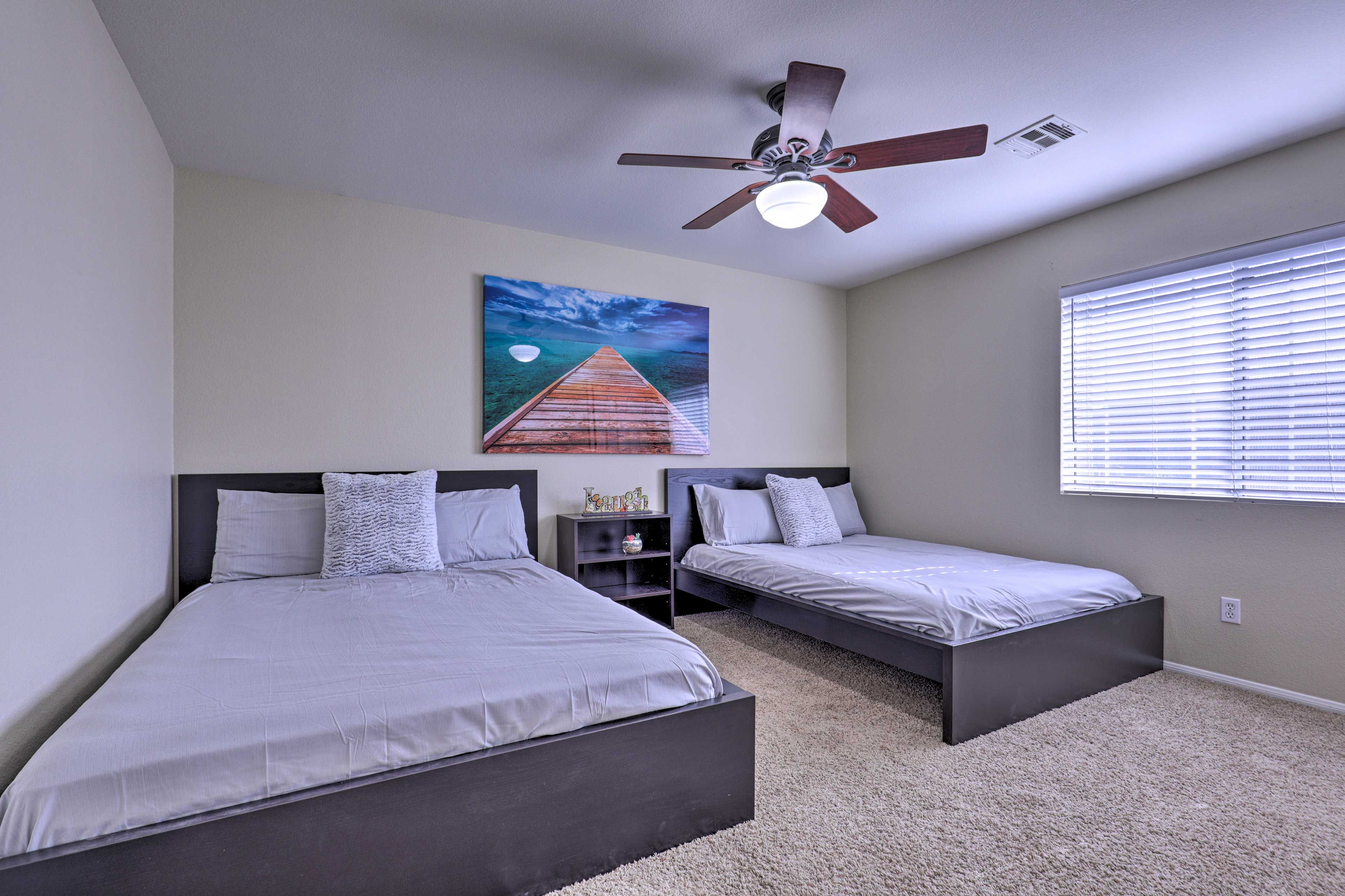 Another set of queen beds can be found in this room.