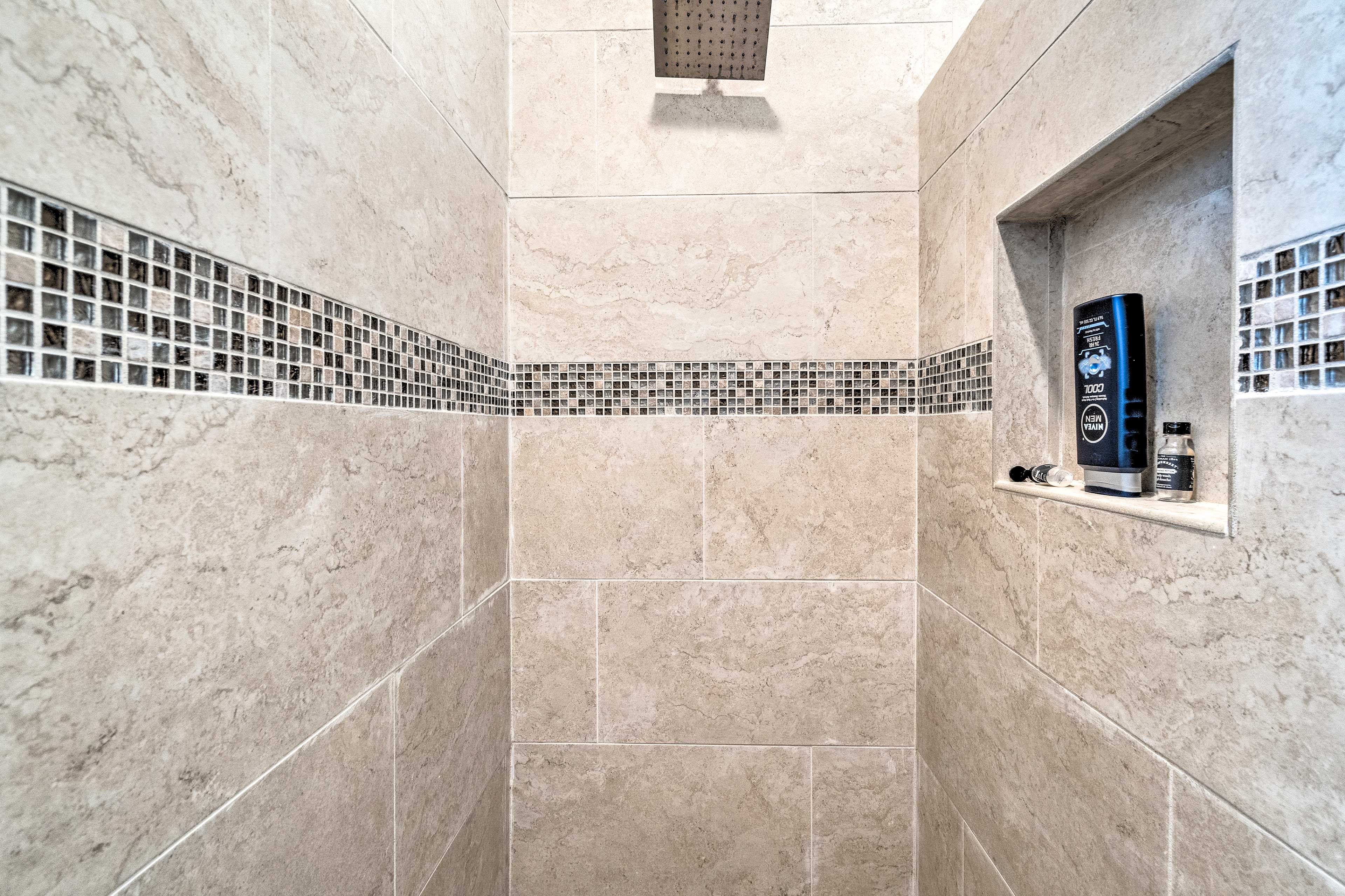 Rinse away the day with the tile-lined shower.