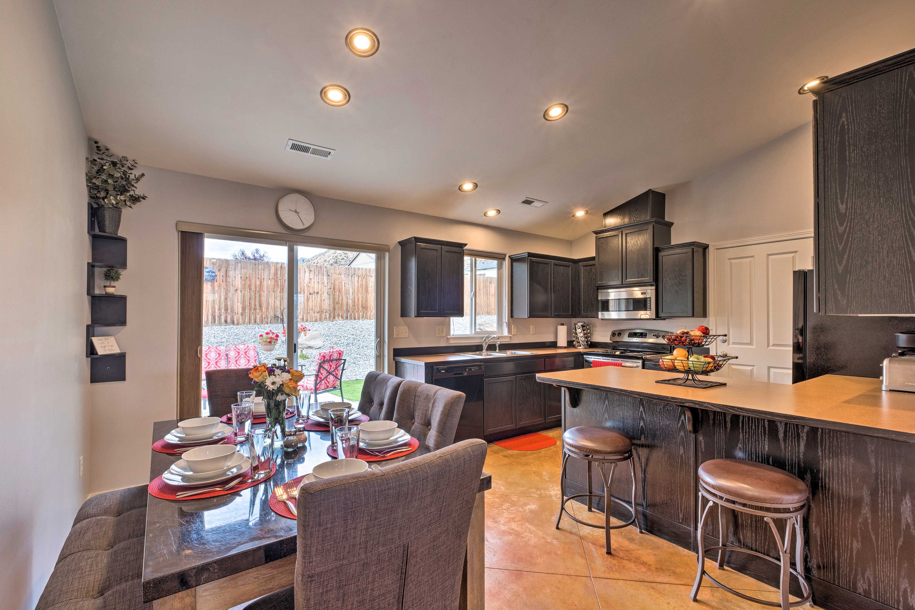 Find the kitchen and dining area through the open doorway.