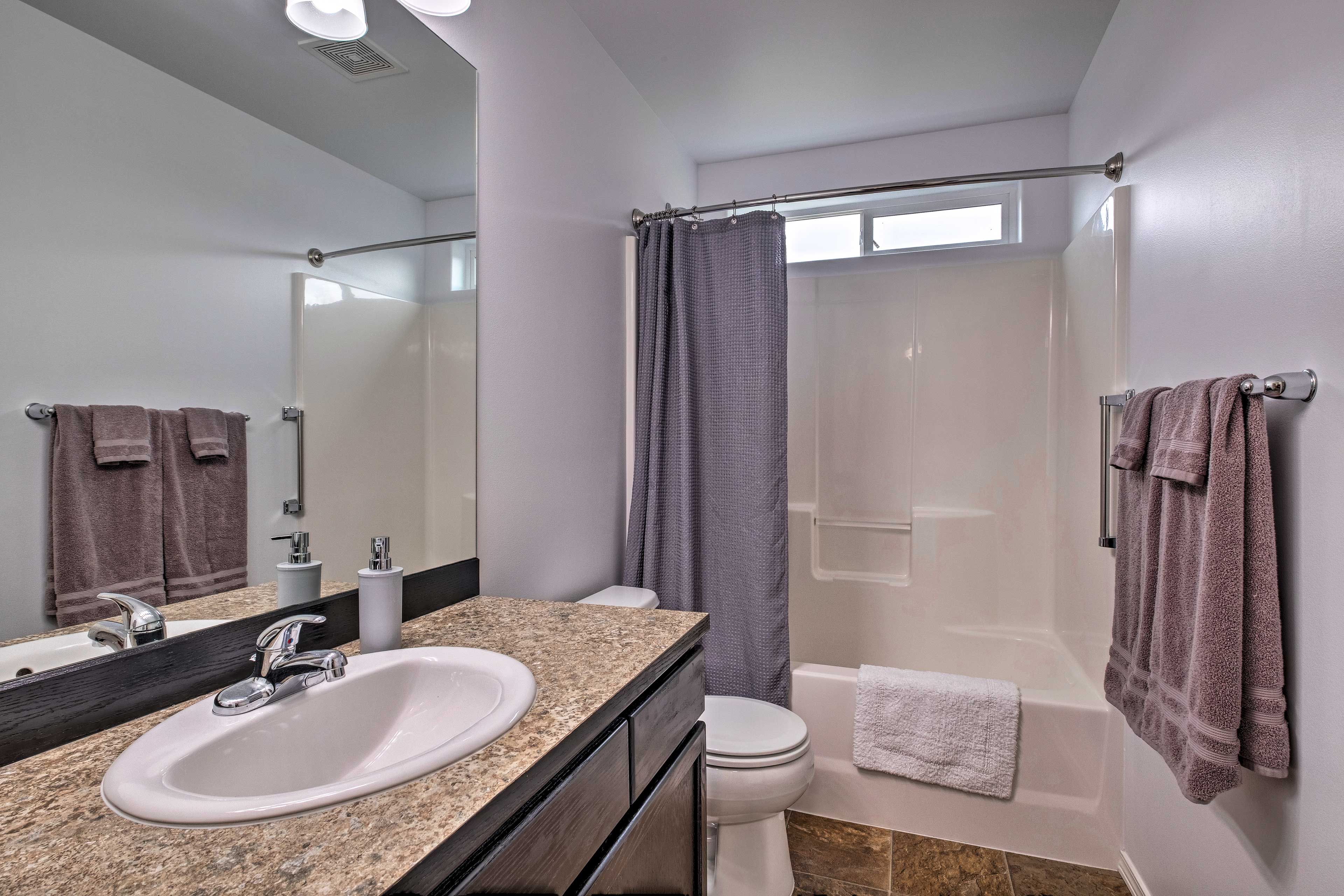 Both full bathrooms feature shower/tub combos.