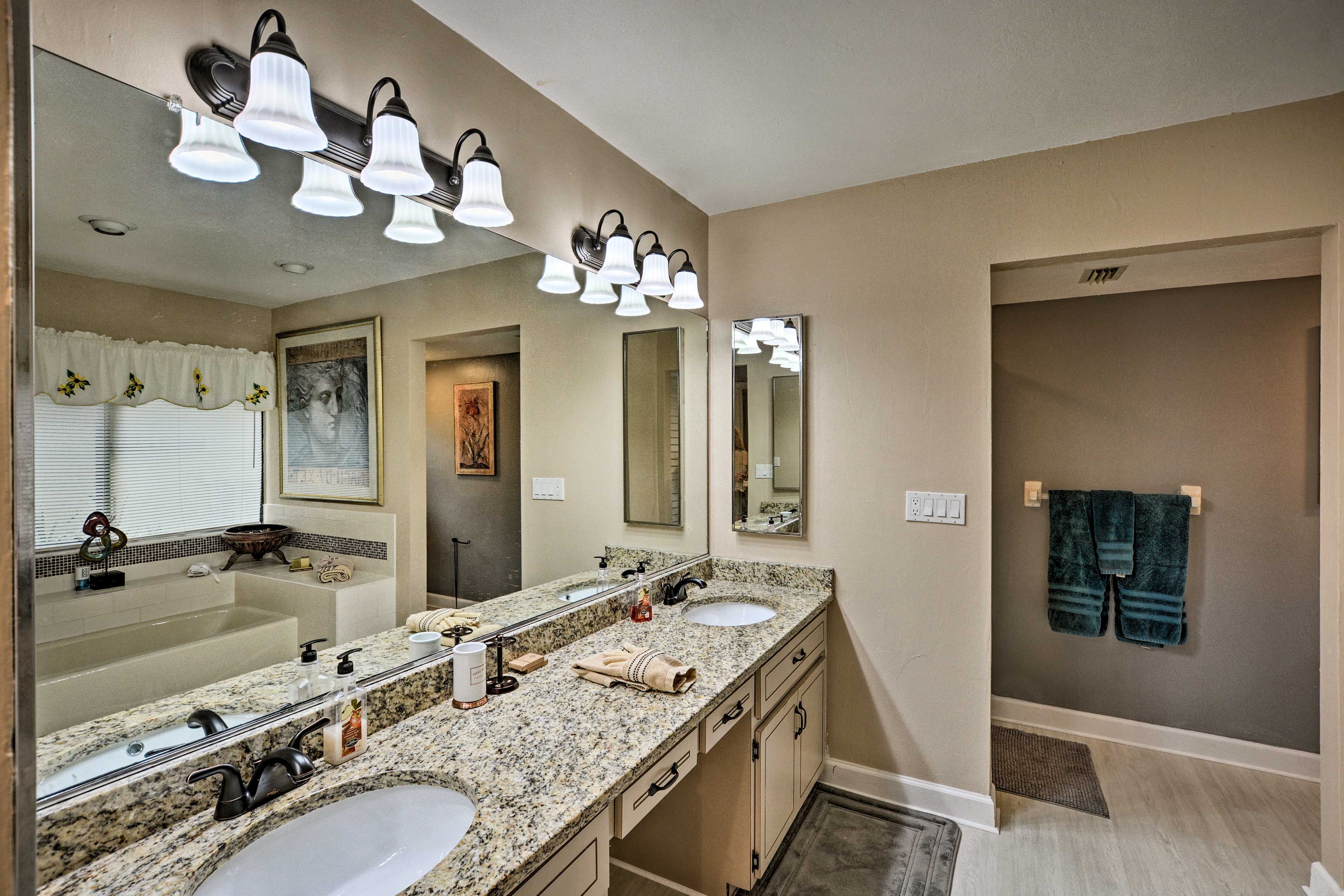 The en-suite bathroom has plenty of space for couples with dual sinks.