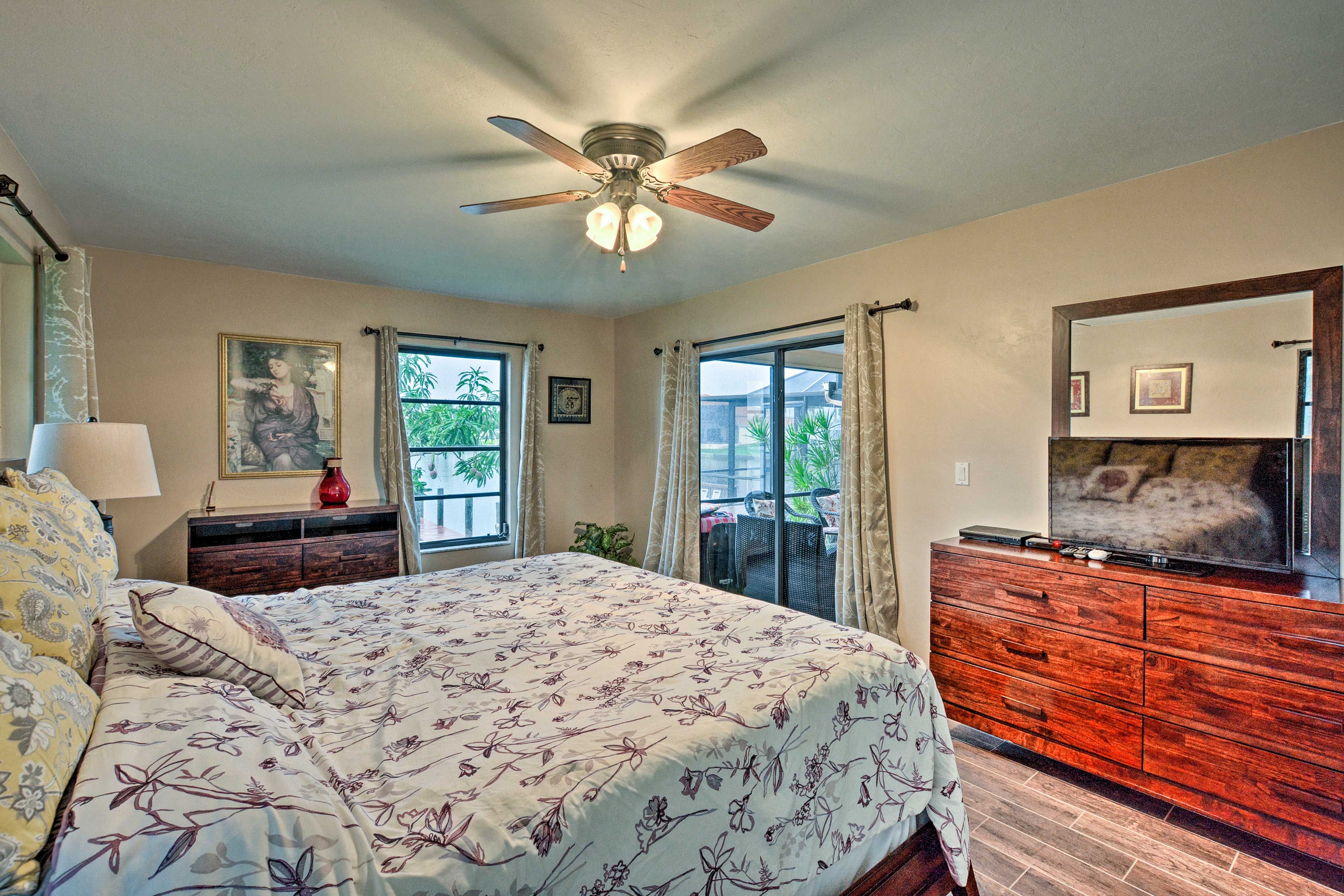 The first bedroom features a king-sized bed and flat-screen TV.