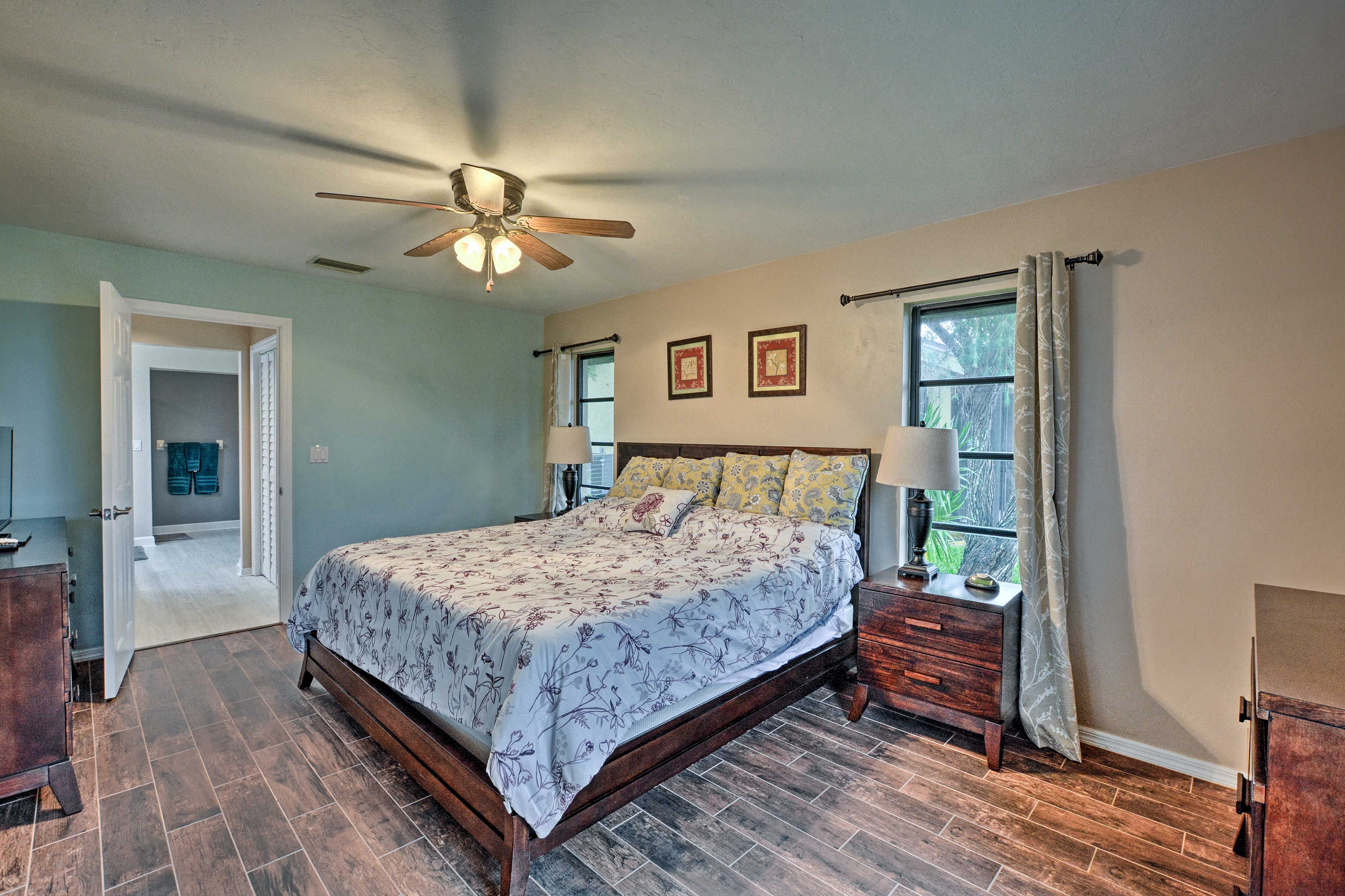 Open the curtains and wake up to dappled sunlight in the modern room.