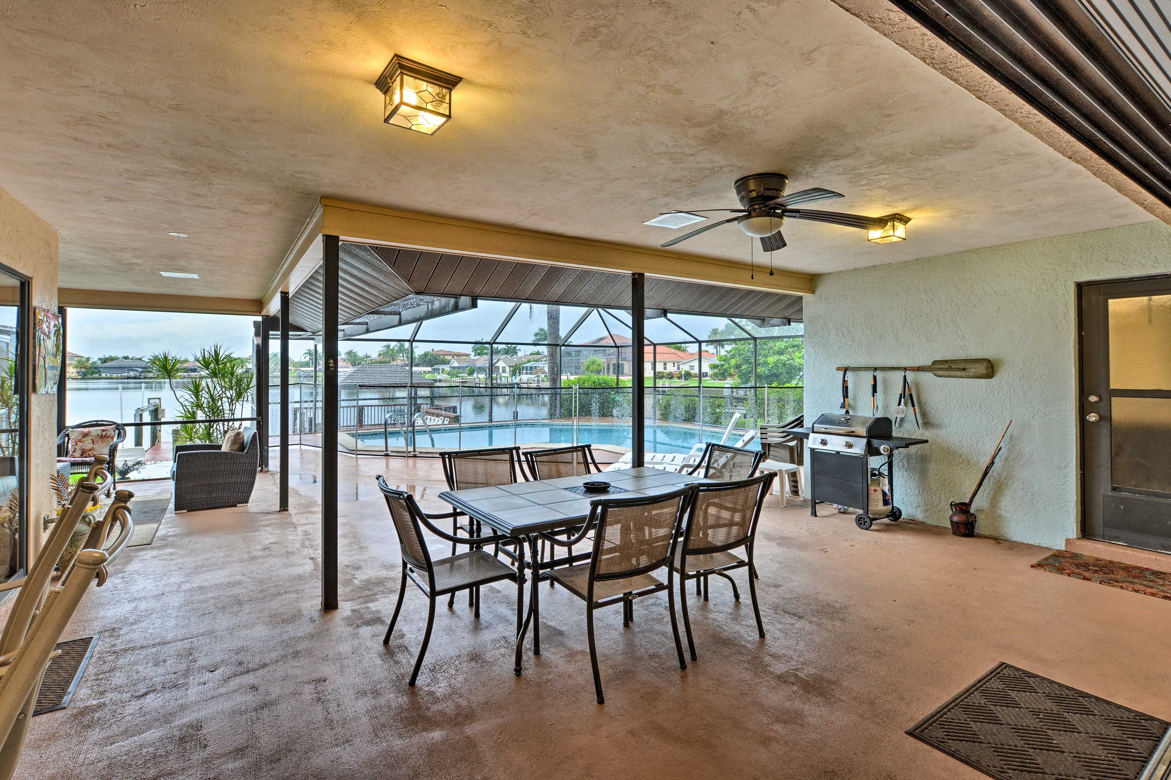 Step onto the covered patio and grill up some burgers on the gas grill.